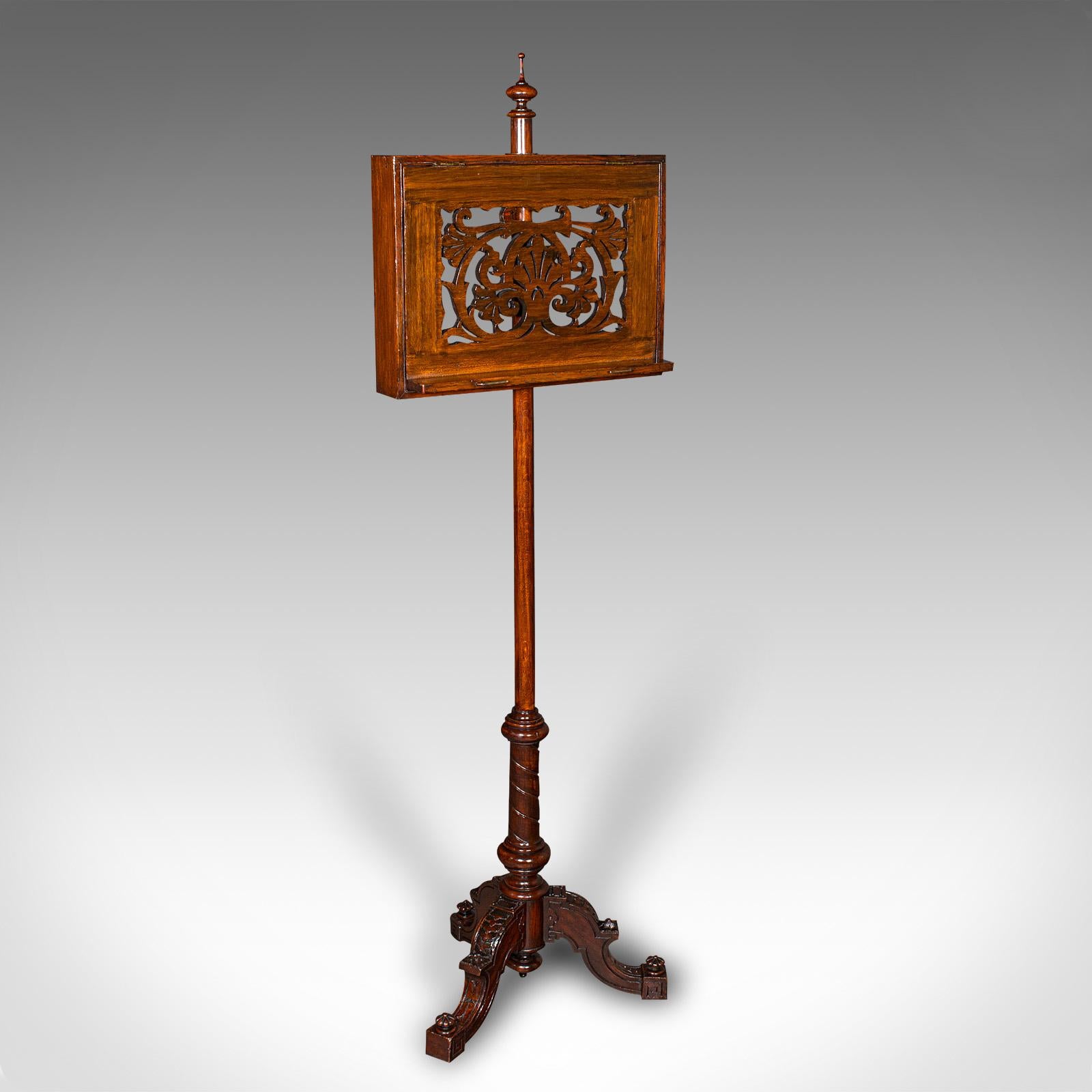 This is a tall antique music stand. An English, oak adjustable recital rest, dating to the late Victorian period, circa 1880.

Strikingly decorative stand with fine craftsmanship and of good proportion
Displays a desirable aged patina and in good