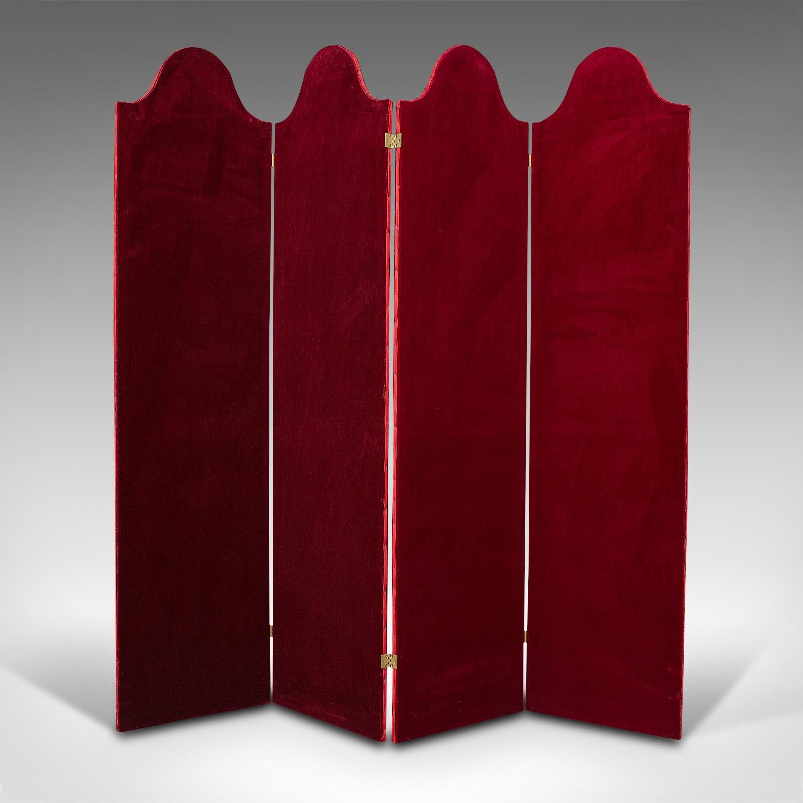 This is a tall antique room divider. An English, velvet boudoir or privacy screen, dating to the Edwardian period, circa 1910.

Dashing and inviting screen of generous proportion for the larger room
Displaying a desirable aged patina and in good