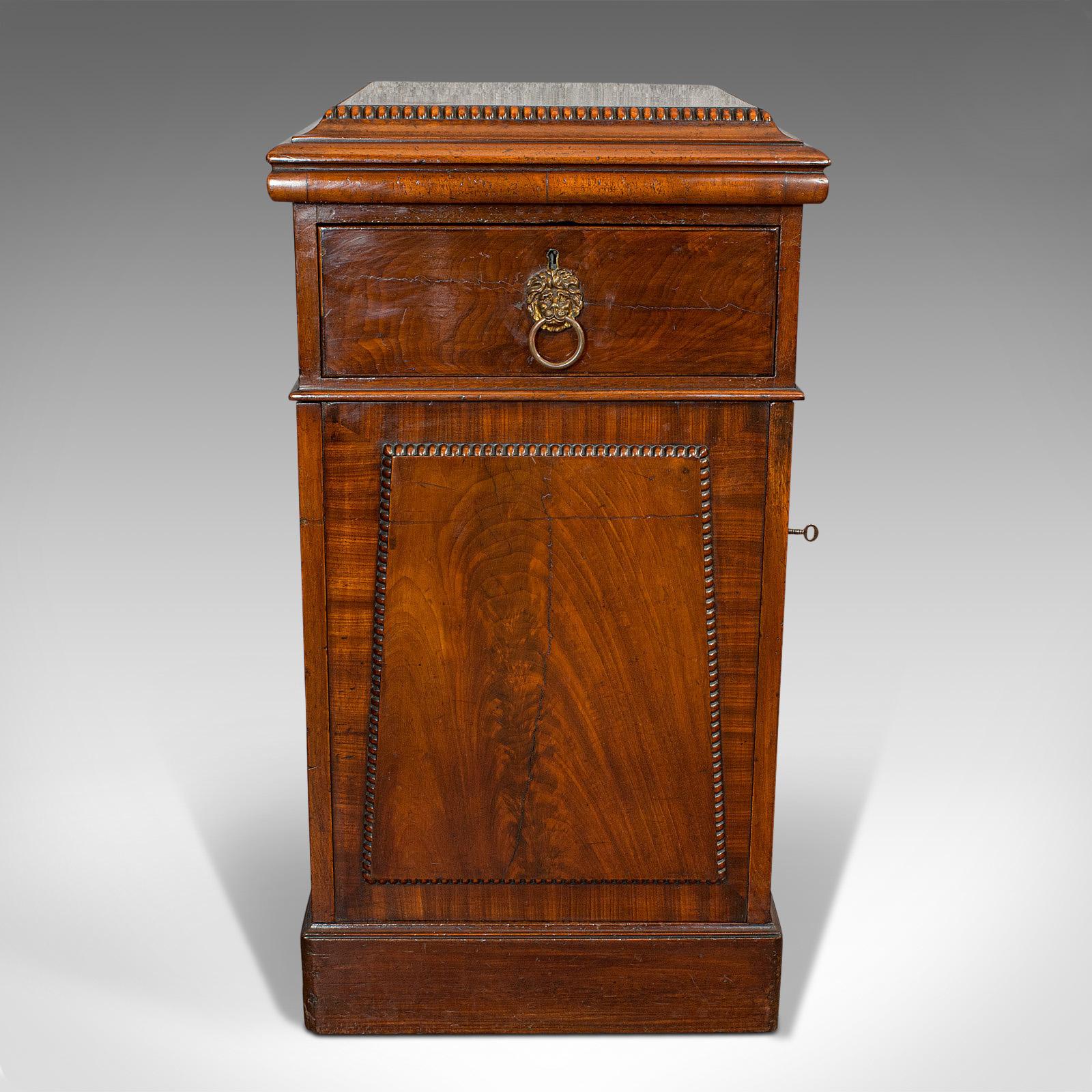 This is a tall antique side cabinet. An English, mahogany drawing room cabinet or bedside nightstand, dating to the Regency period, circa 1820.

Appealing Regency cabinetry with rich color
Displaying a desirable aged patina
Select mahogany shows