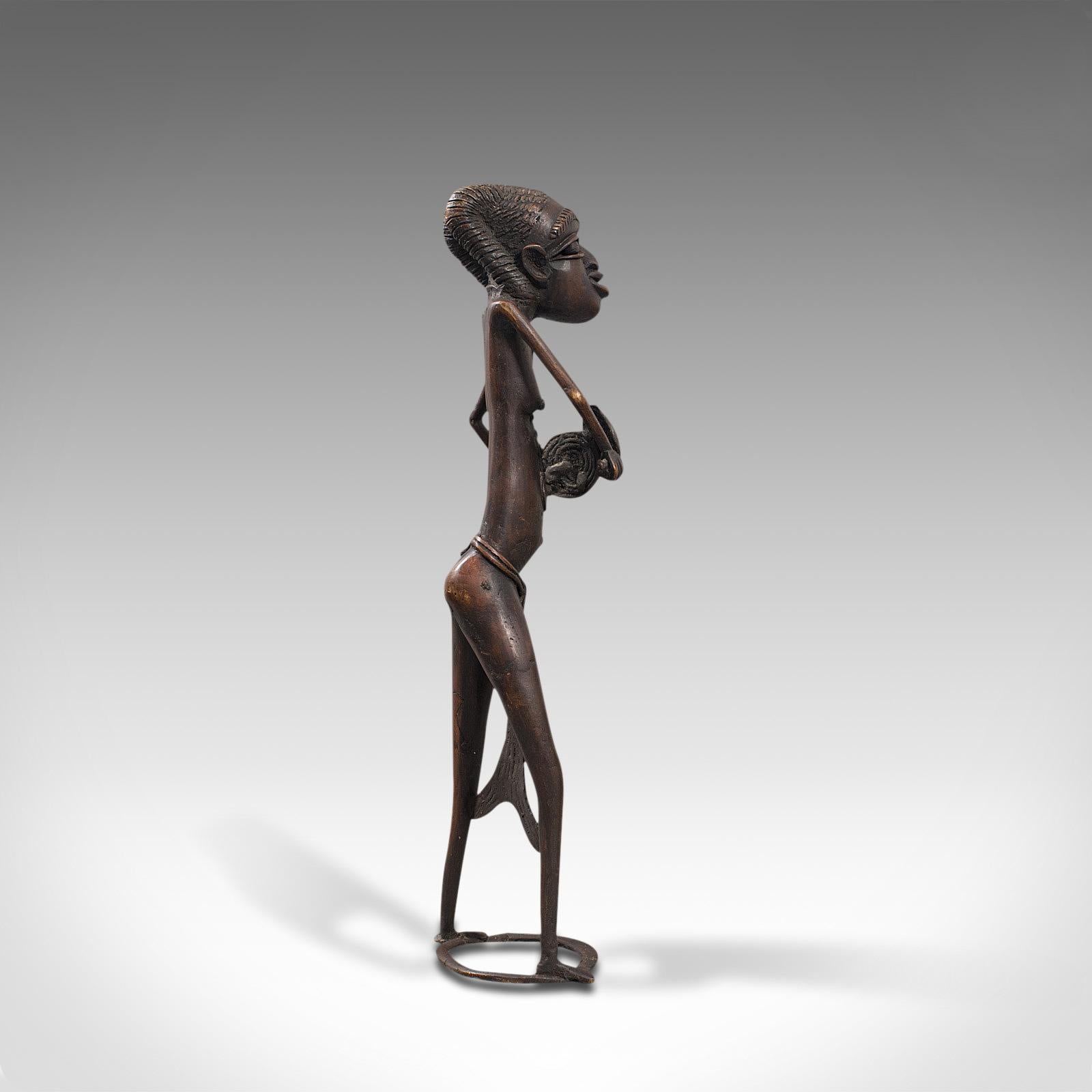 tall african woman statue