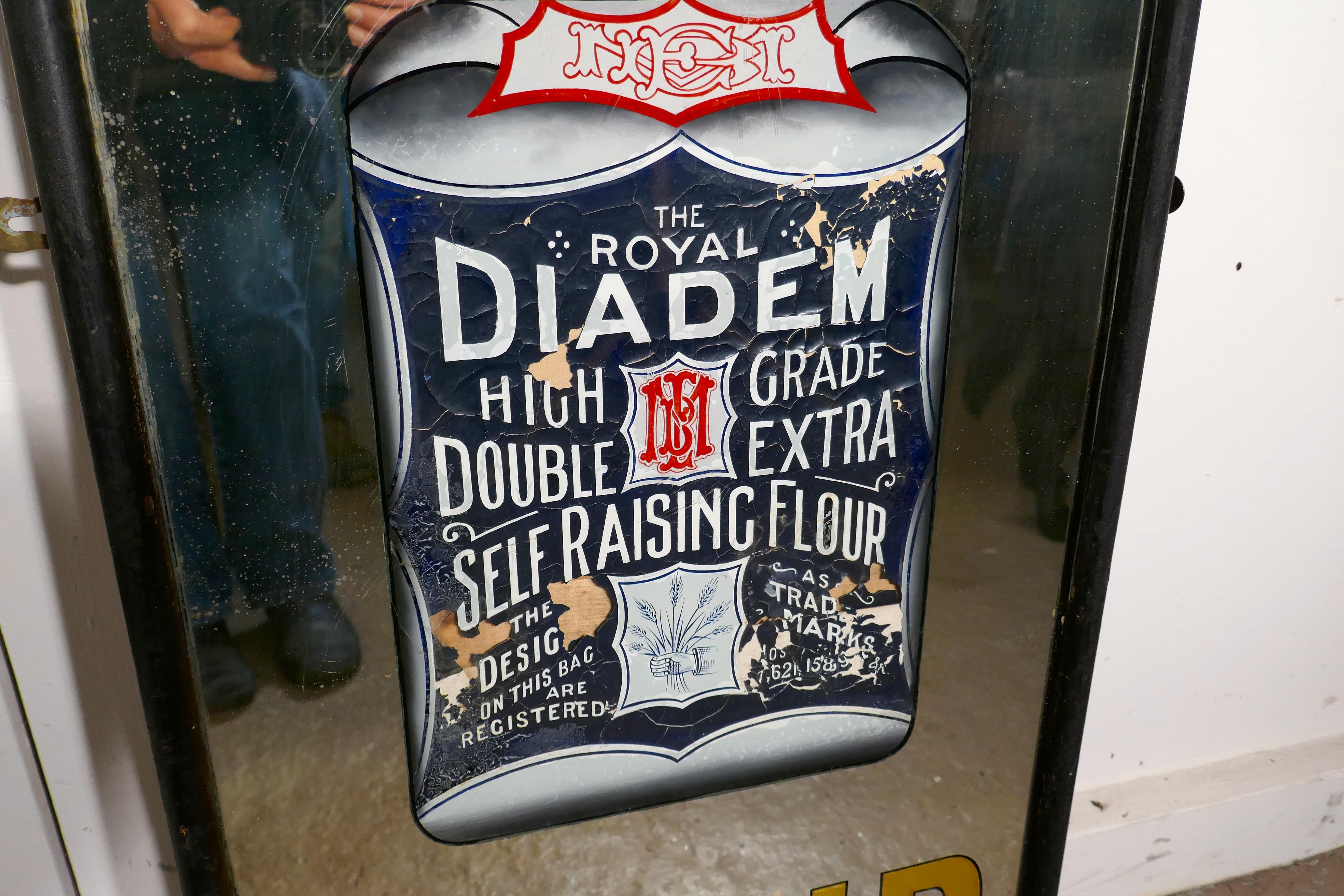 Tall Art Deco advertising mirror, Diadem Flour.

The mirror is advertising Diadem flour, with a picture of a flour packet at the centre and “ASK FOR DIADEM FLOUR” in gold leaf and Odeon style etching to the glass
This is a tall mirror it has a