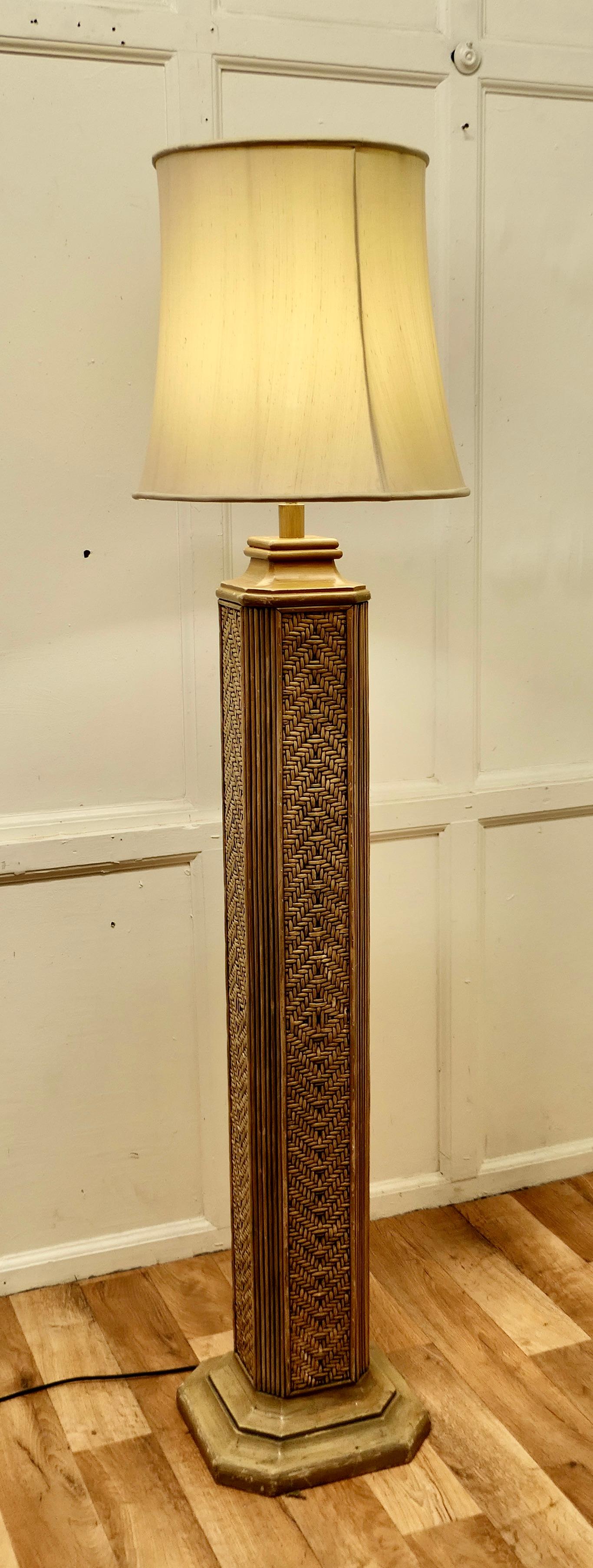 Tall Art Deco bamboo cane column floor lamp.

This is a very stylish Art Deco column floor lamp.
The lamp has a square shaped column in a pattern woven bamboo and it is set on an Odeon style base matching the top mouldings. 
The lamp is in good