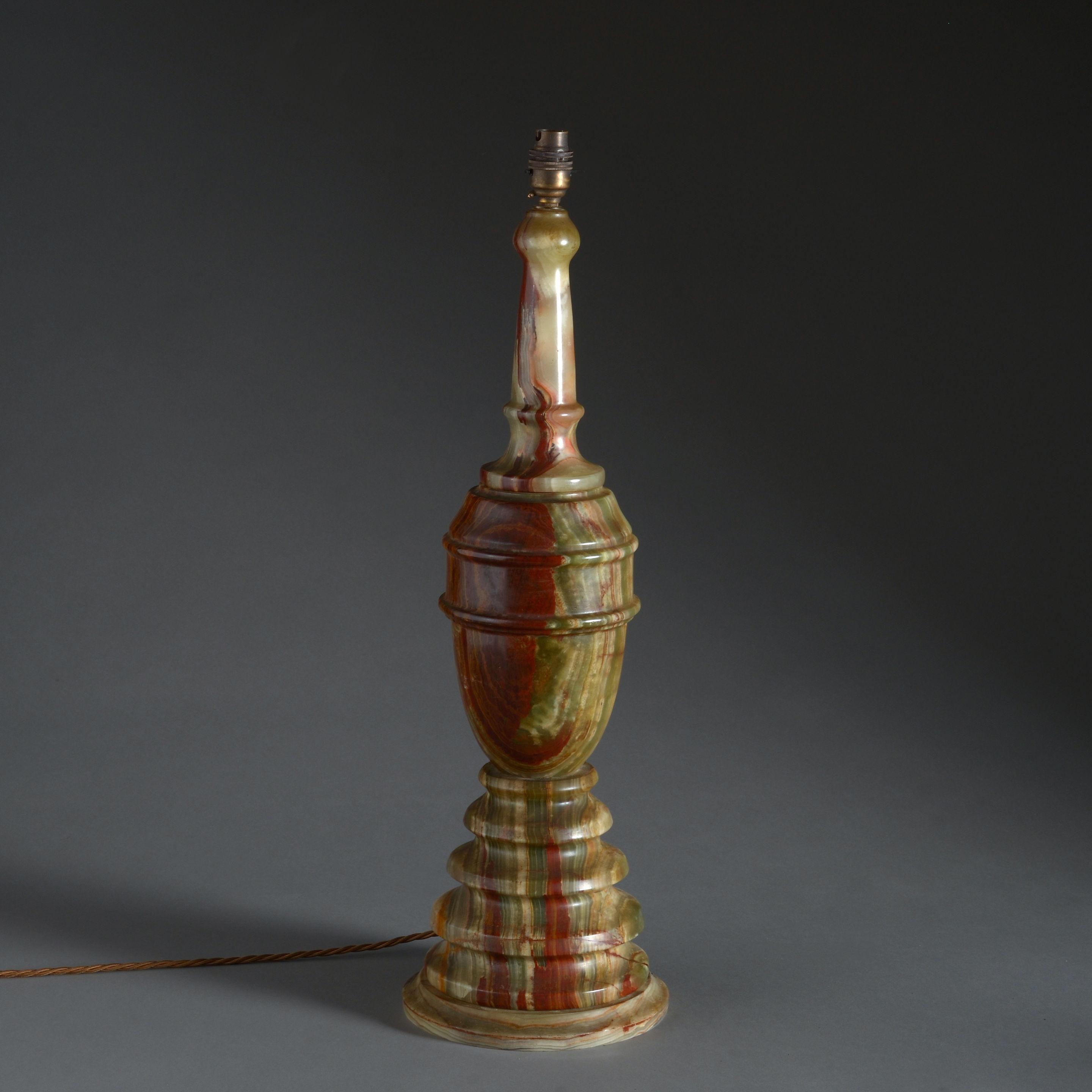 A tall early 20th century Art Deco period turned onyx table lamp.