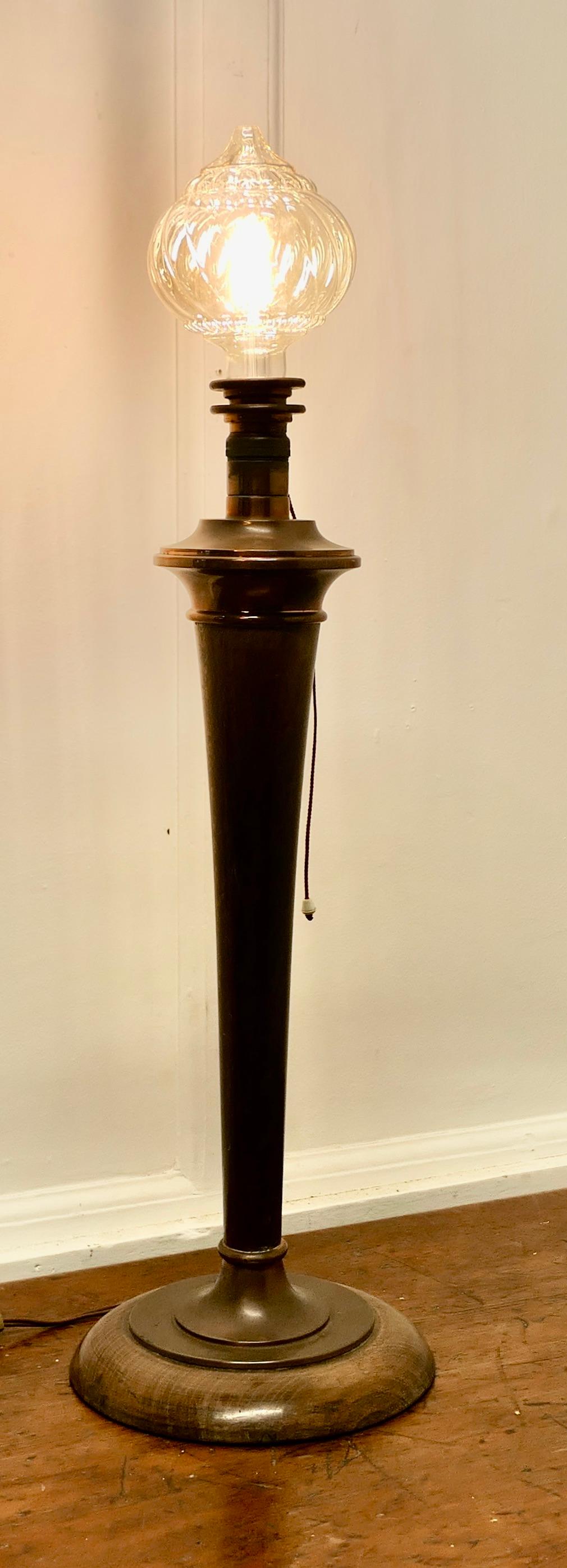 Tall Art Deco Walnut and Copper Table Lamp

This is  a very attractive Table Lamp from the 1920s brought right up to date with a modern Big Globe Crystal Light bulb which is included with the lamp, the wiring is fairly new
The Lamp is 30” tall, 9”