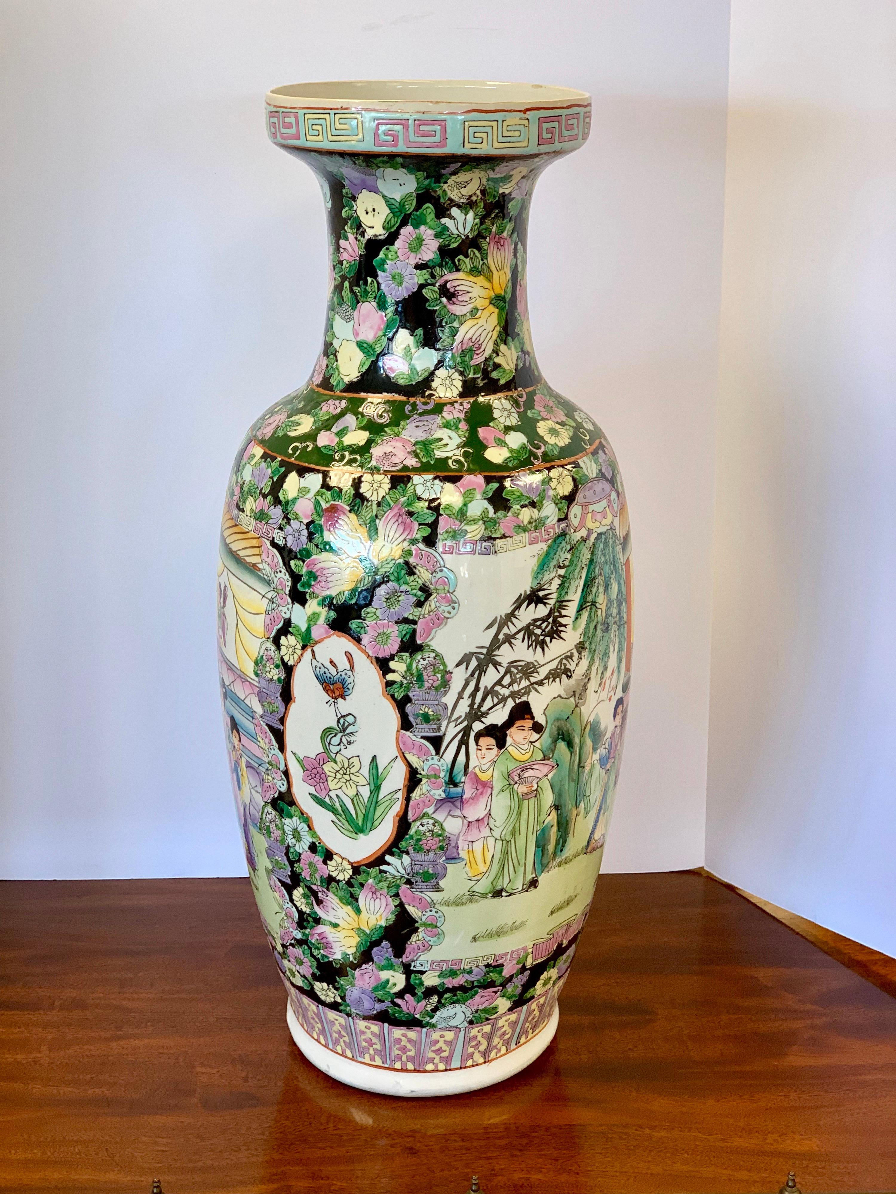 Standing twenty five inches tall, is this beautiful Chinese urn in the famille noir pattern.  There are hallmarks at bottom but they are hard to read, see pics.