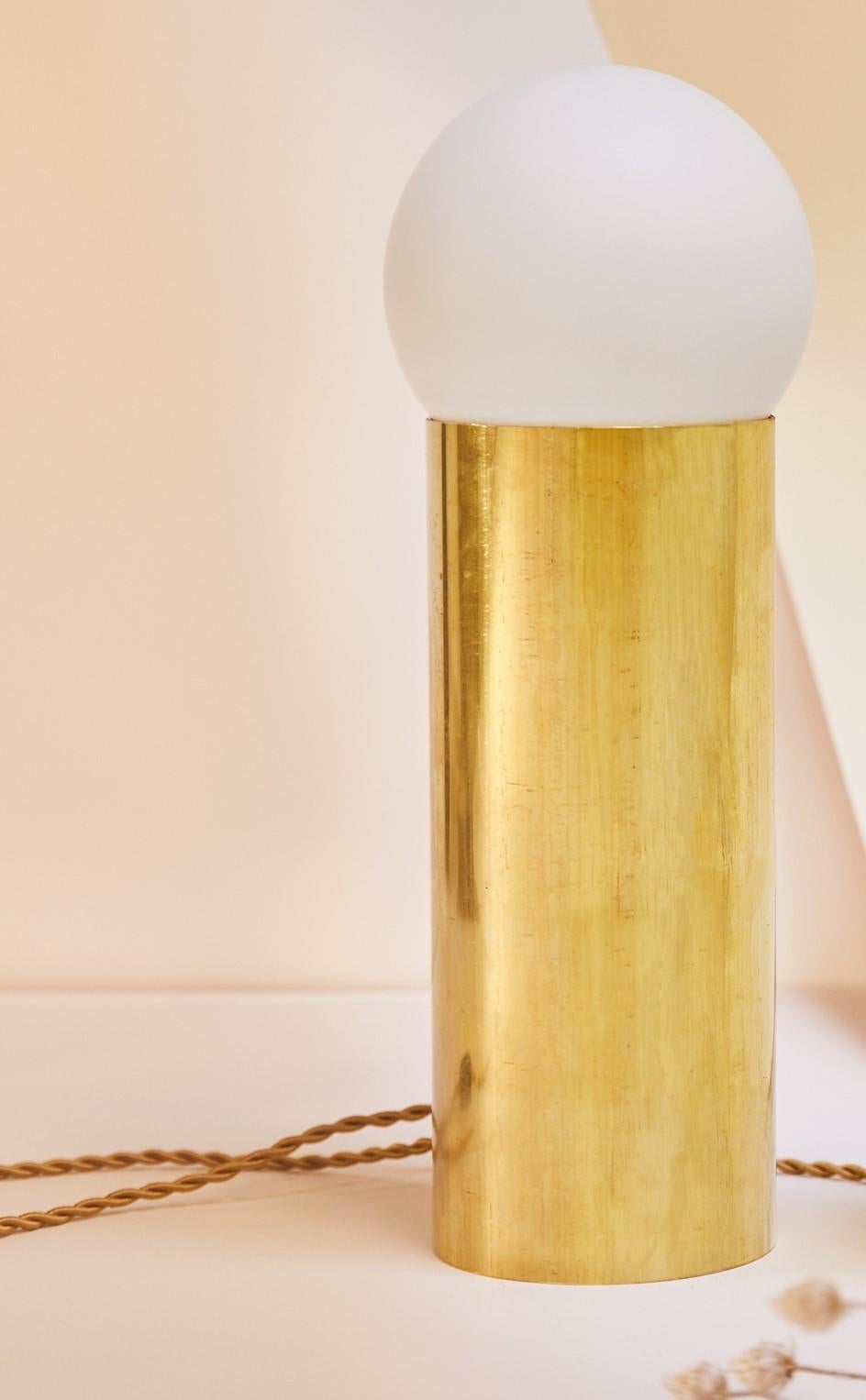 Tall astree lamp by Pia Chevalier
Raw solid brass and porcelain.
Dimensions: H 24 cm ø11cm
Tala bulb: diameter 13 cm
Cable length: 1m 50

Pia Chevalier is a French contemporary designer.
Independent Designer, trained in Design and Crafts and