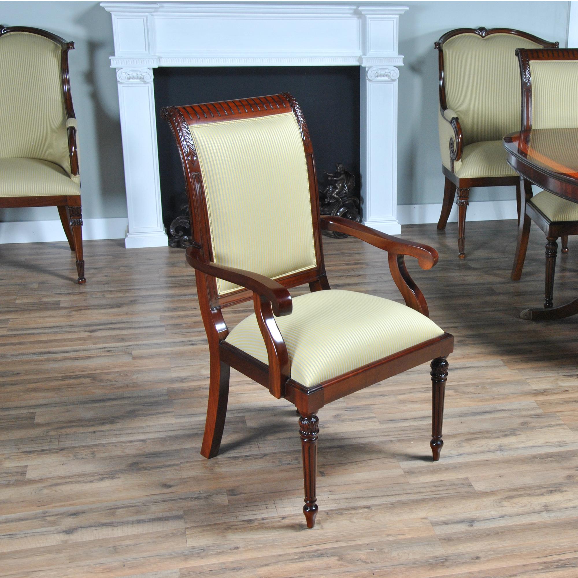 The set of Tall Back Upholstered Chairs consists of 2 arm chairs and 8 matching side chairs. The chairs in this set are both finely detailed and deceptively simple in appearance. If that is the type of chair you are seeking then invite this set home