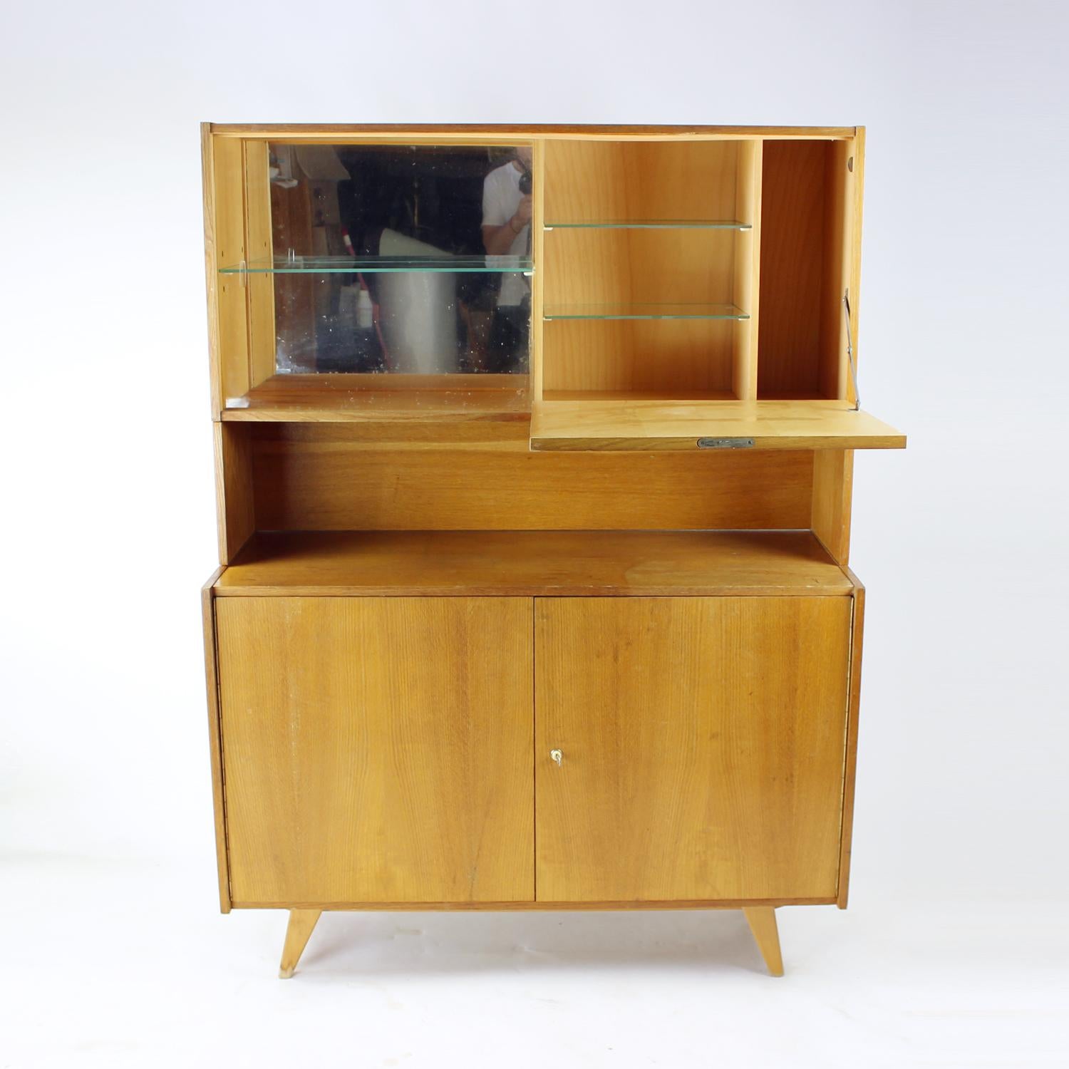 Beautiful tall bar sideboard designed by Jiri Jiroutek for Interier Praha in Czechoslovakia, original labels still attached. The sideboard consists of three parts. The bottom part is the U 460 sideboard with oak wood veneered finish. The two doors
