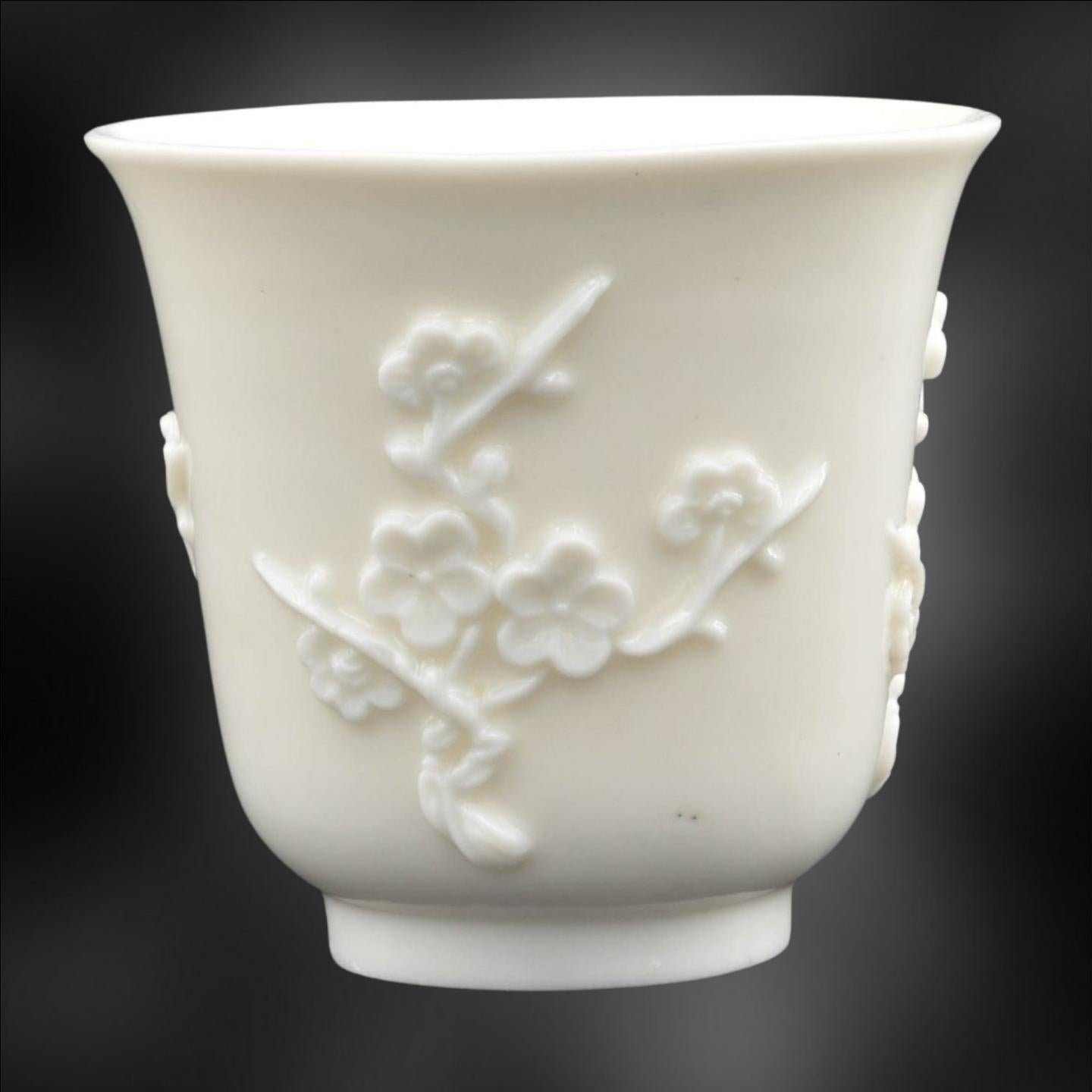 A striking beaker, in Dehua’s luscious porcelain. An unsually bright white for Dehua, which is very attractive.

A tall beaker, of pleasing shape, with simple decoration of Prunus. The form used is similar to that copied by Chelsea in London.