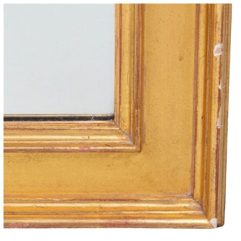 A tall, beveled, giltwood frame mirror.  A stunning piece, simply elegant and grand in scale.