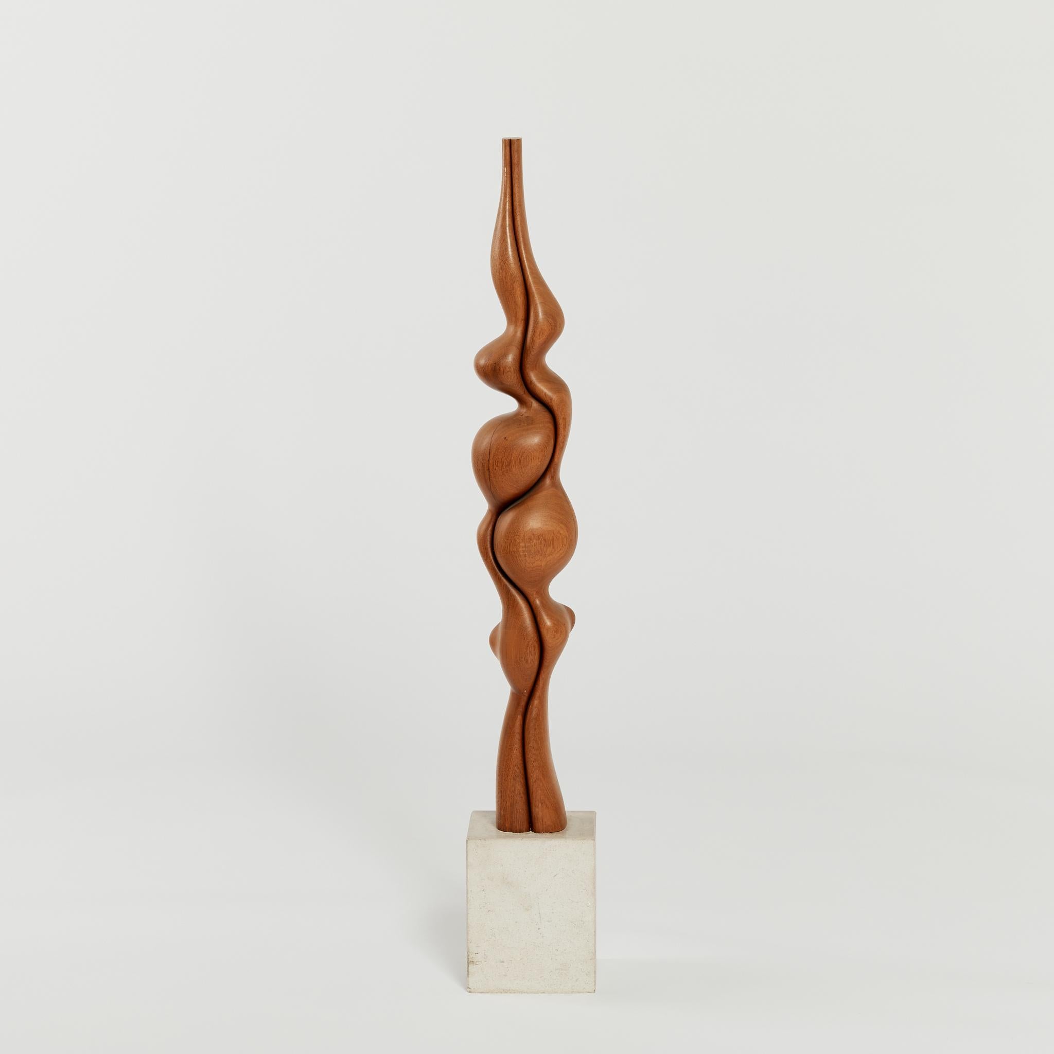 Tall biomorphic wood sculpture. Freestanding, with striking undulating form, this statement piece is mounted on a contrasting concrete plinth.

Artist: Unknown

Dimensions: H 107 x W 18 x D 18cm

Condition: Vintage condition - signs of wear on