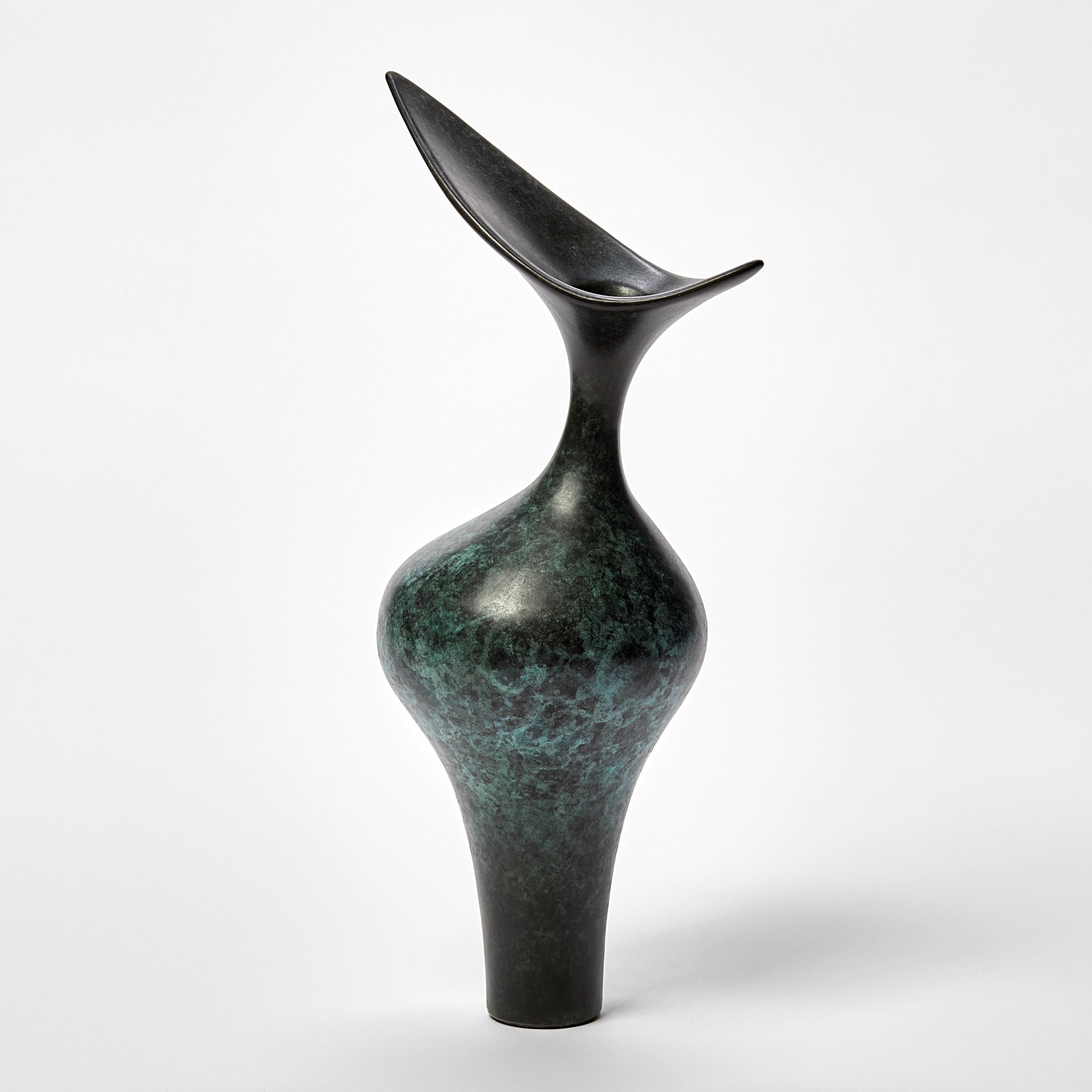 ‘Tall Bird Form’ is a limited edition bronze sculpture by the British artist, Vivienne Foley.

Vivienne Foley is based in Gloucestershire where she produces exquisite ceramic sculpture. Although in essence they are often functional pieces in form,