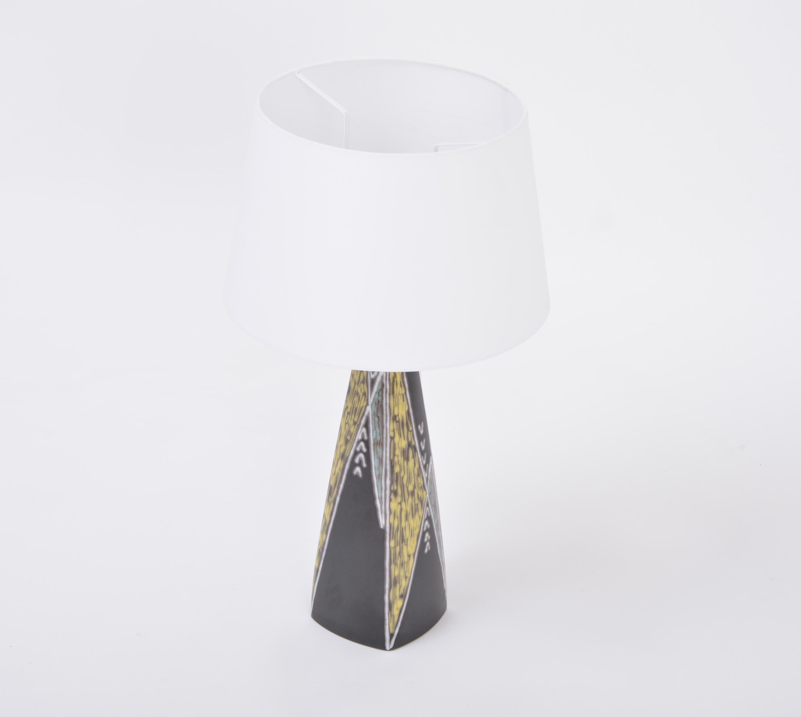Tall black Danish midcentury ceramic table lamp by Holm Sorensen for Søholm

Beautiful tall table lamp designed by Holm Sørensen and Svend Aage Jensen in 1955 for Søholm, Denmark. The design is from their series 