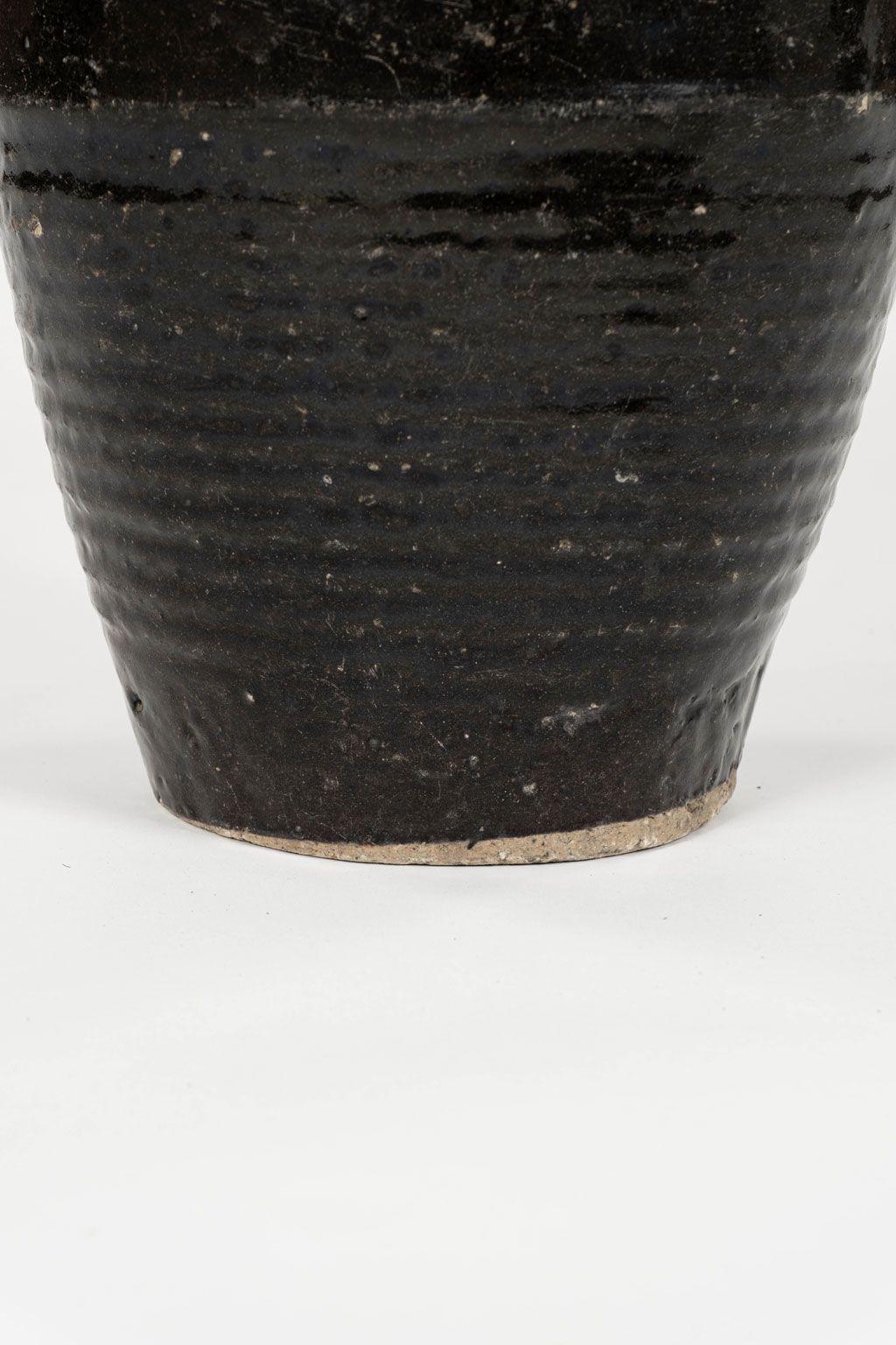 Primitive Tall Black Glazed Pottery Table Lamp with Linen Shade For Sale