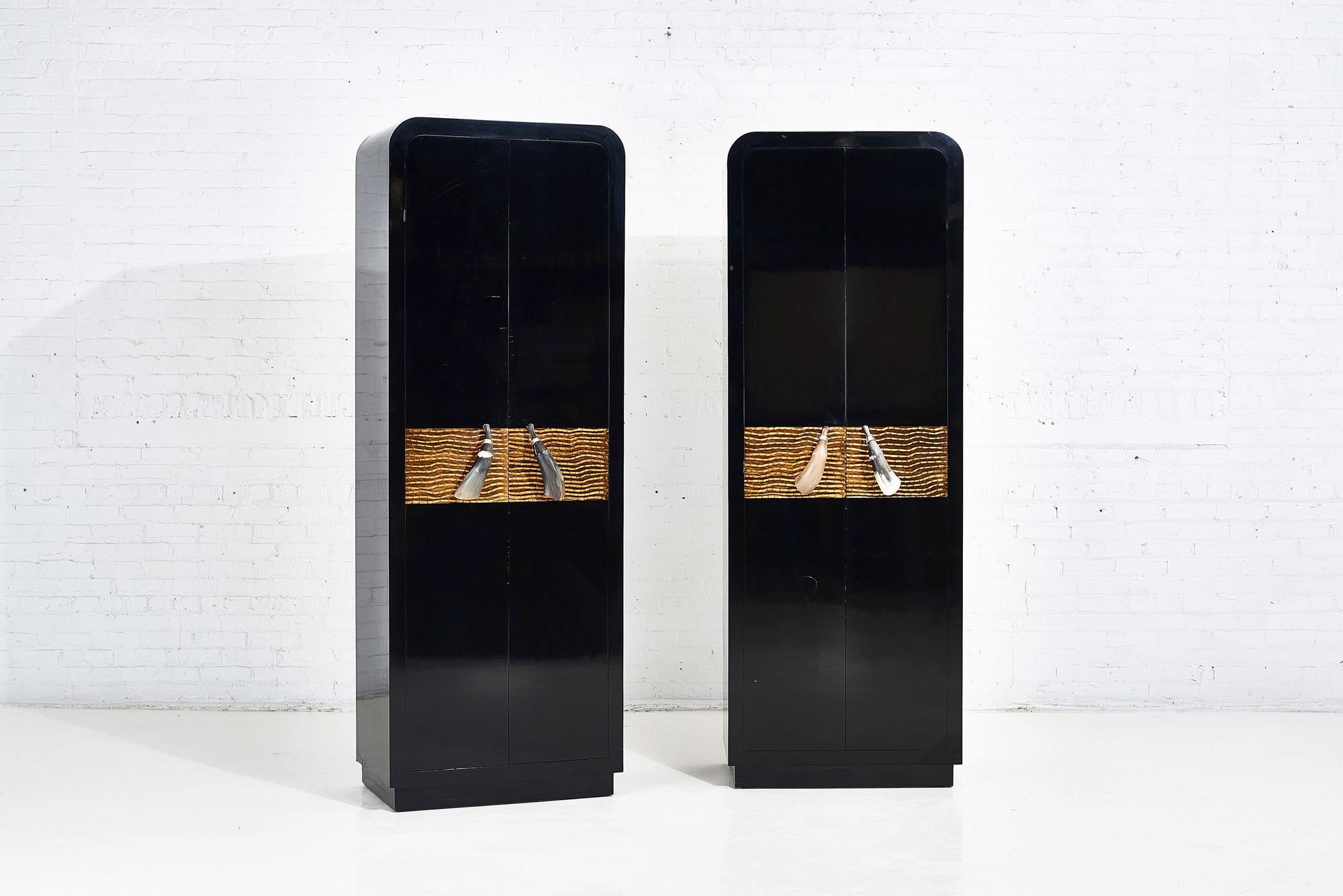 Tall black lacquer cabinet with horn handles.  Signed by Alessandro for Baker.