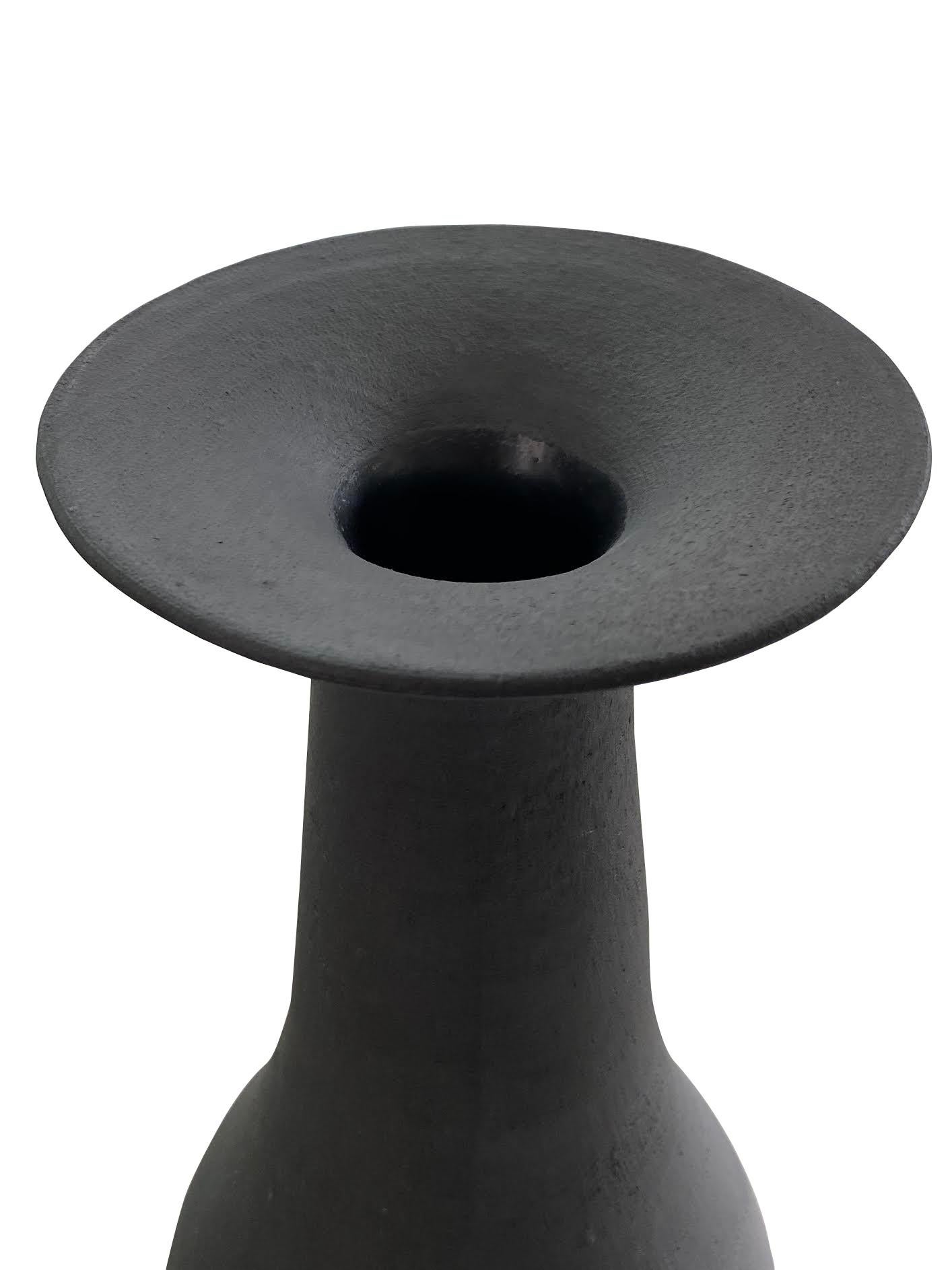Contemporary American ceramicist Sandi Fellman smooth tall black vase.
Stoneware, black terra sigillata (fine black slip).
Heavy in weight designed to hold large branches for display purposes.
Can hold water.
One of a collection of three (S5650