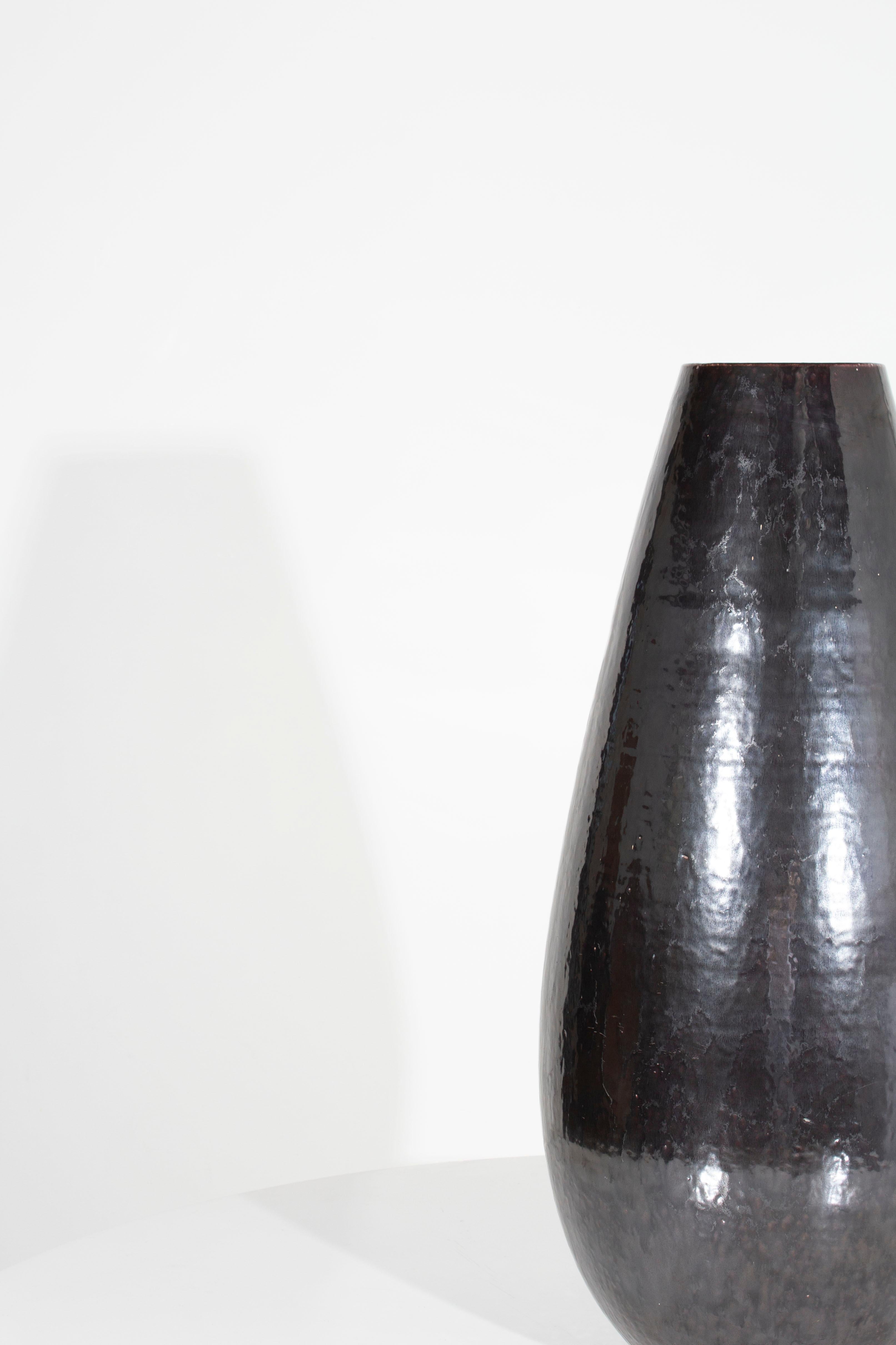 Tall black vase with hammered distressed steel finish

Sold individually, 2 available.

Piece from our one-of-a-kind collection, Le Monde. Exclusive to Brendan Bass. 
In my organic, contemporary, vintage and mid-century modern aesthetic.

Globally