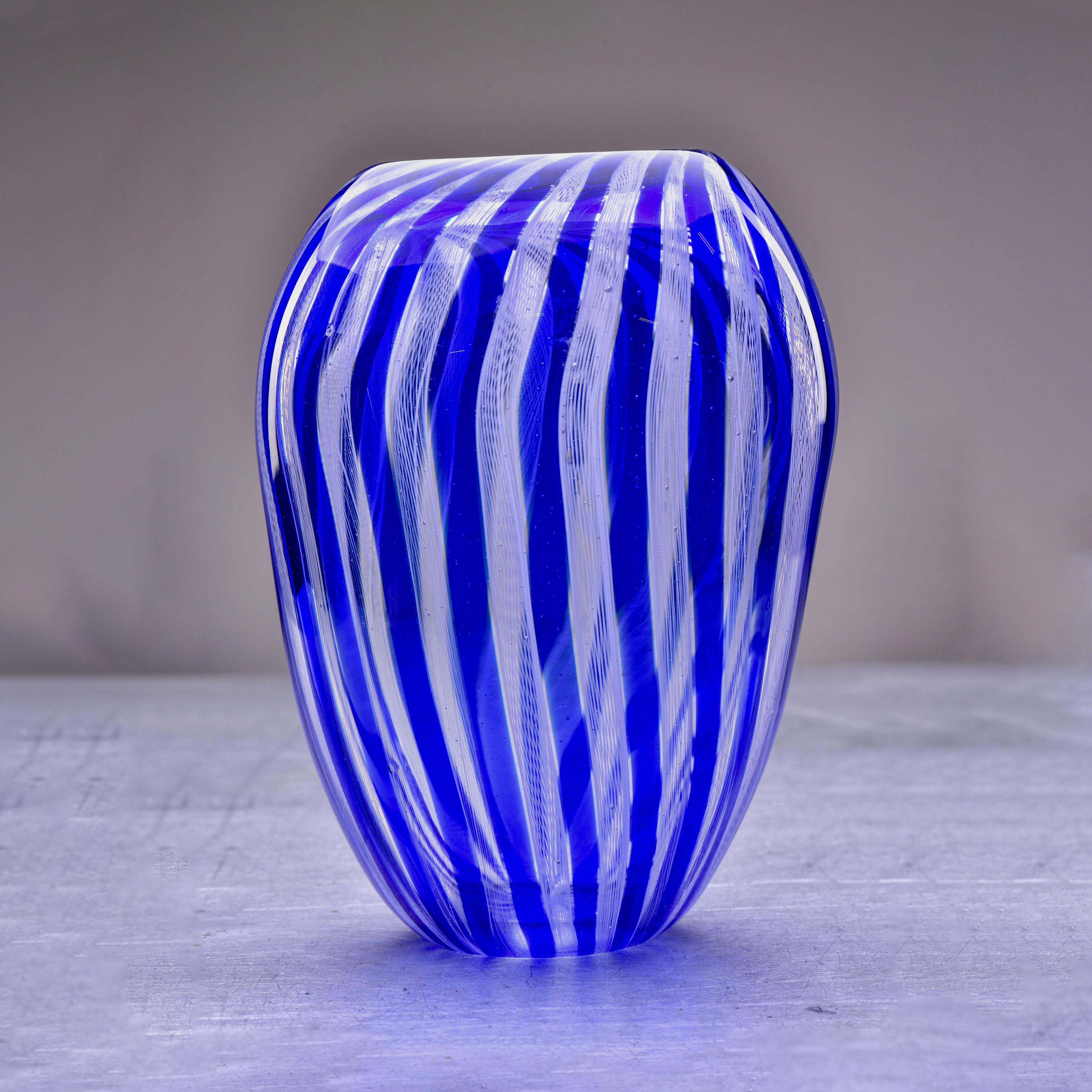 Circa 2020 tall blue and white filigree striped zanfirico Murano glass vase. Unsigned, unknown Murano maker.