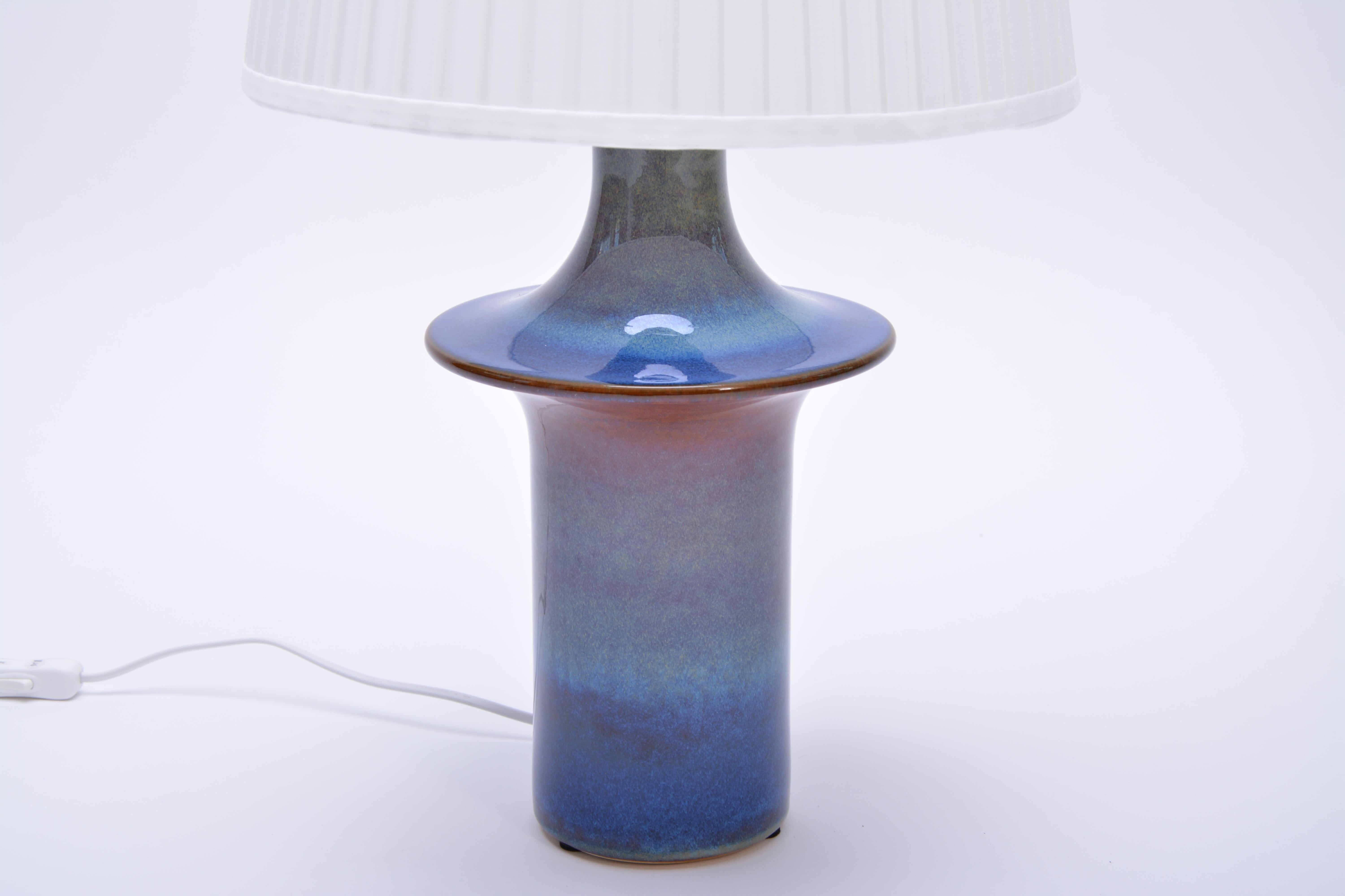 Tall blue Danish Mid-Century Modern Ceramic table lamp by Soholm

Tall blue Danish Mid-Century Modern Ceramic table lamp by Soholm
Table lamp made of stoneware with ceramic glazing in beautiful tones of blue produced by Soholm Stentoj in Denmark in
