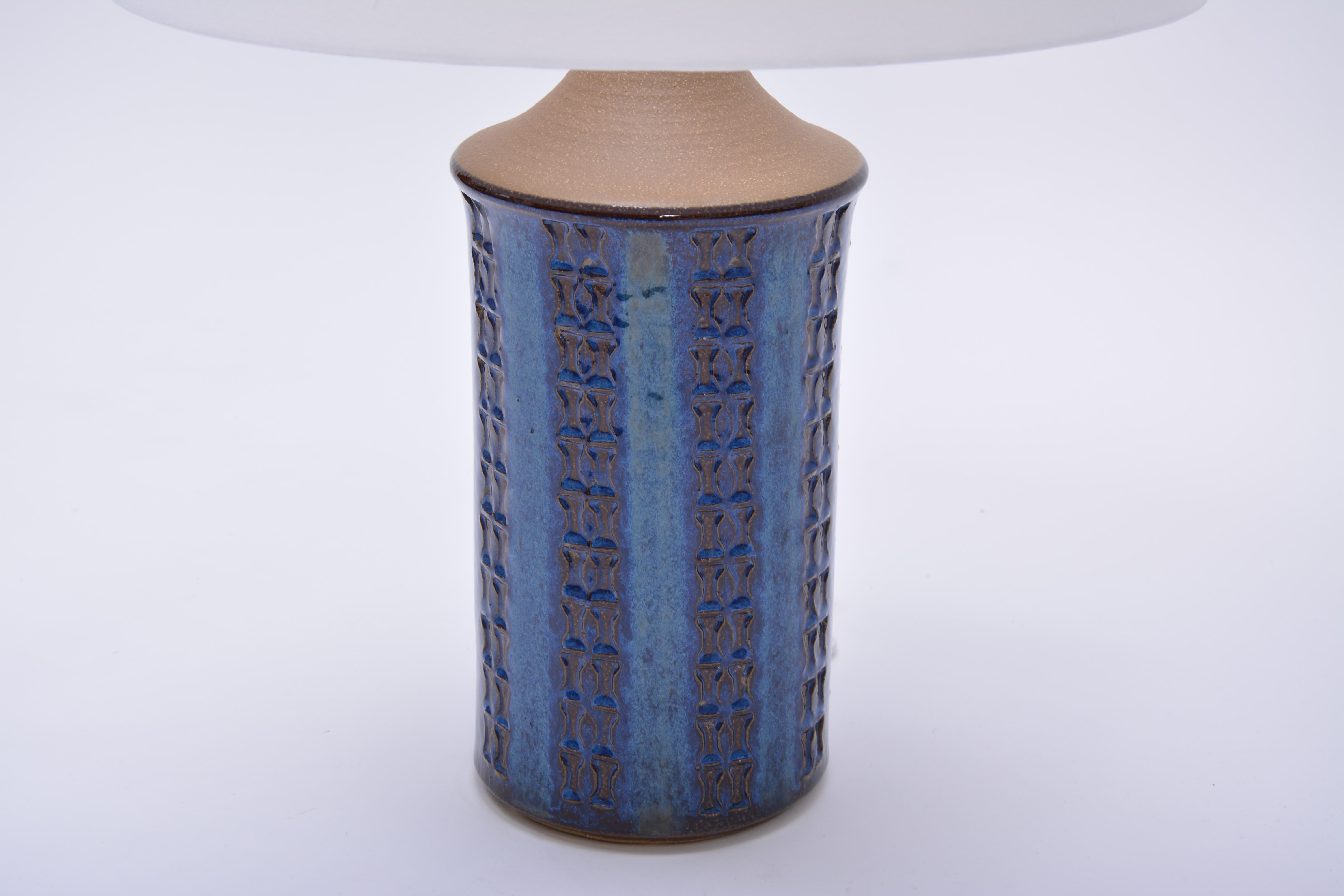 Vintage table lamp produced by Soholm Stentoj in the 1970s in Denmark. The lamp is made of stoneware and features a geographic pattern. Beautiful glaze in various tones of blue. The lamp has been rewired and has a new shade.