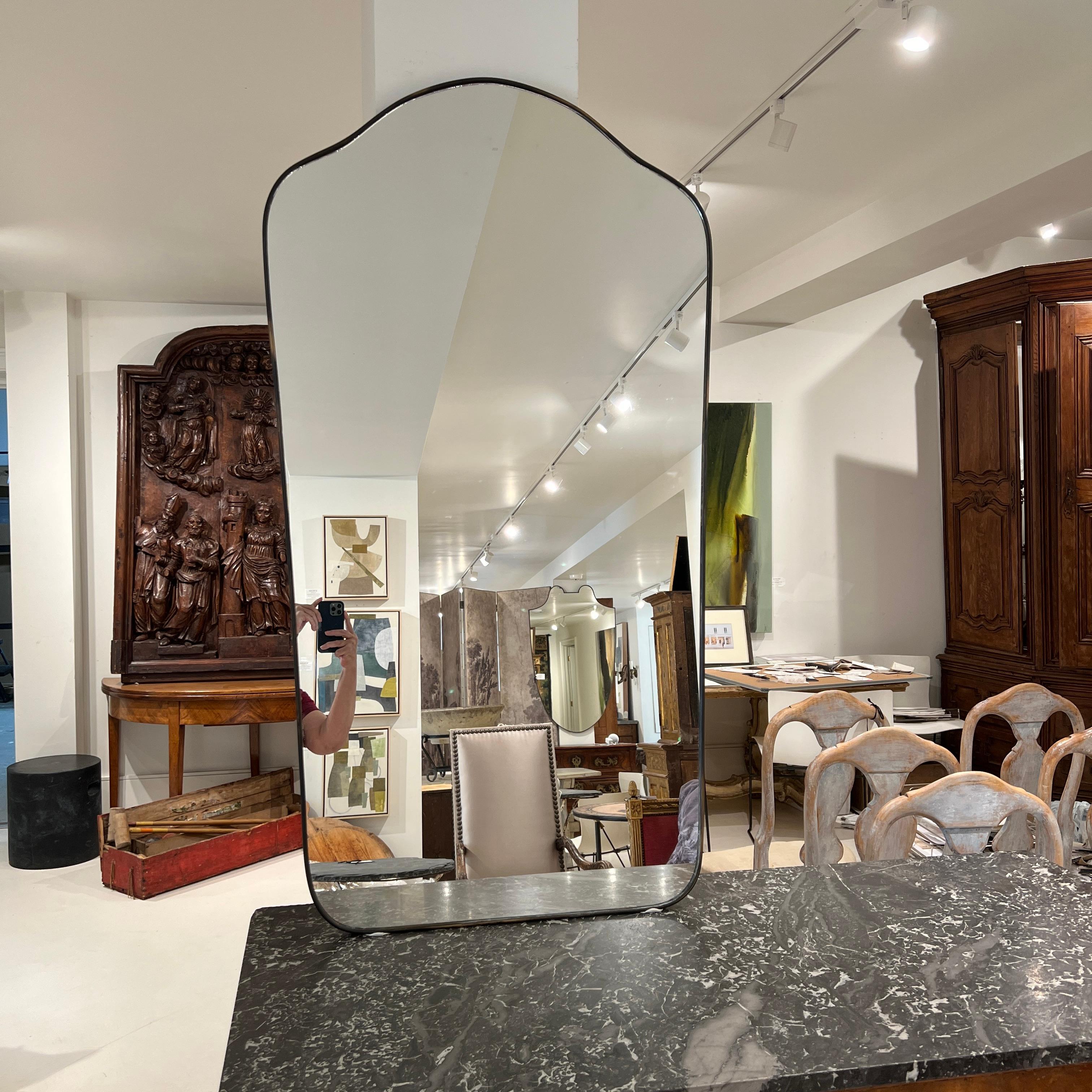 Magnificent shield mirror. Highly desirable and on-trend right now. Would add class to any room.
