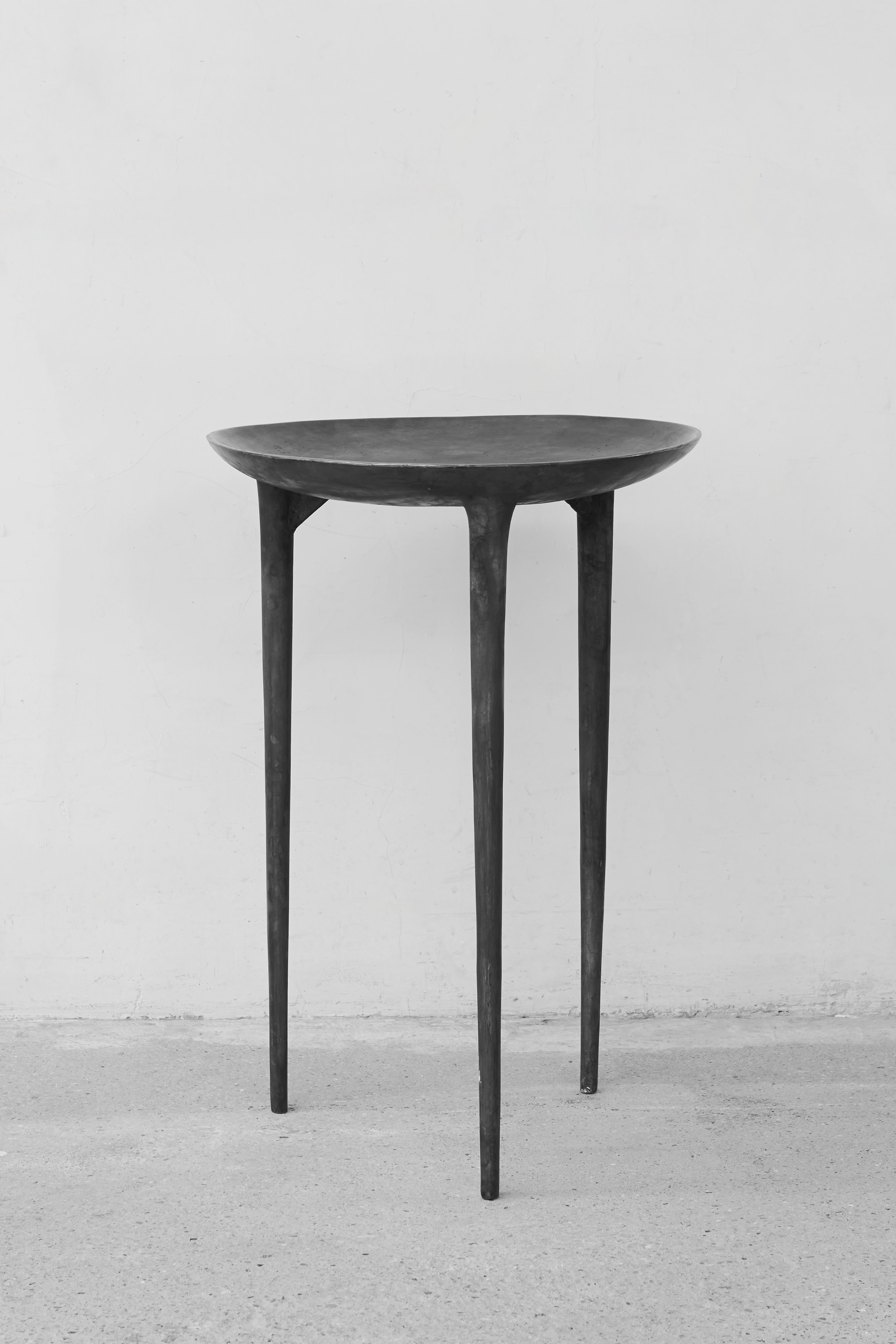 Tall brazier table by Rick Owens
2007
Dimensions: L 42 x W 42 x H 59 cm
Materials: Bronze
Weight: 25 kg

Rick Owens is a California-born fashion and furniture has developed a unique style that he describes as “luxe minimalism.”
Though his