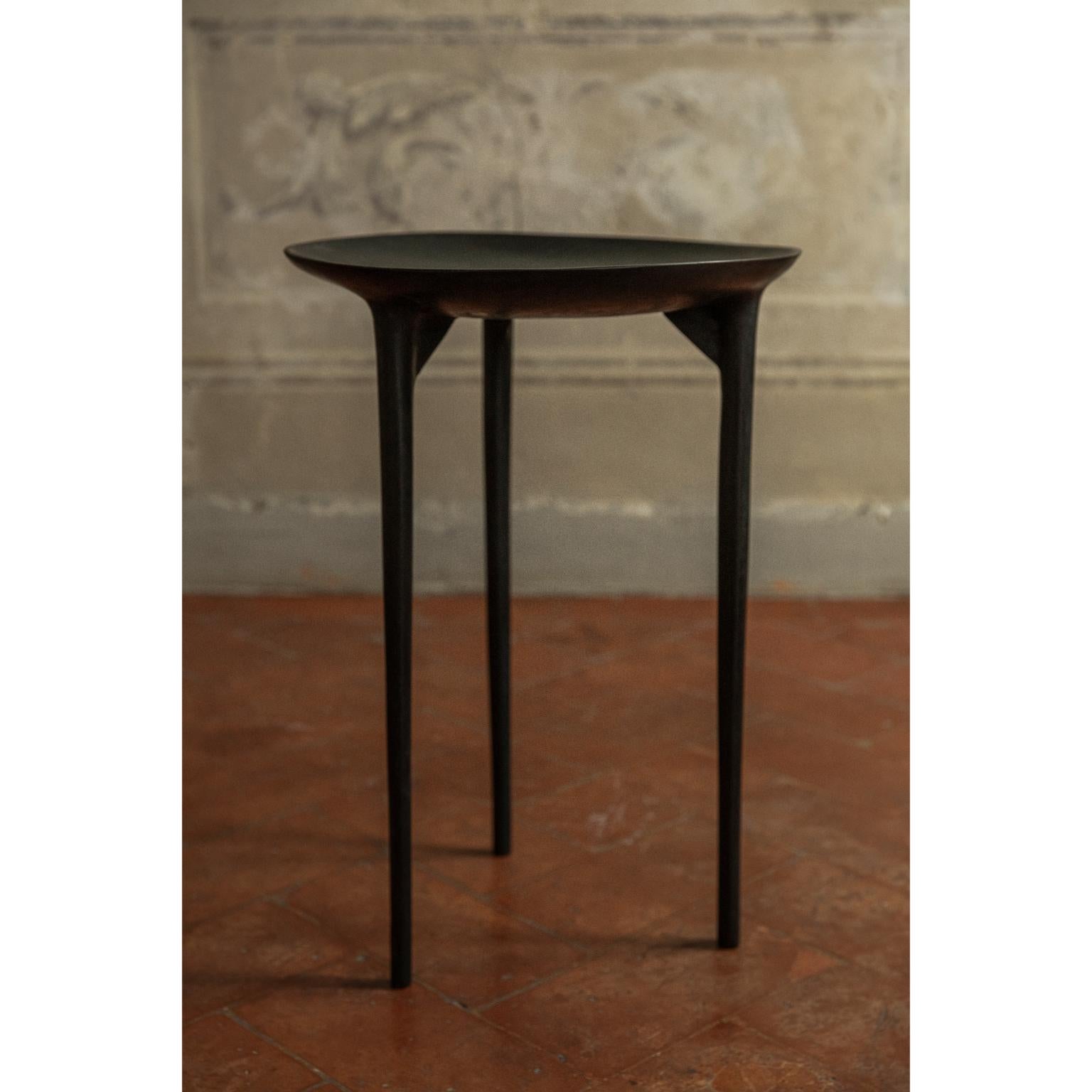 Tall brazier table by Rick Owens
2007
Dimensions: L 42 x W 42 x H 59 cm.
Materials: Bronze
Weight: 25 kg

Available in black finish or nitrate (dark brown) finish.

Rick Owens is a California-born fashion and furniture has developed a unique