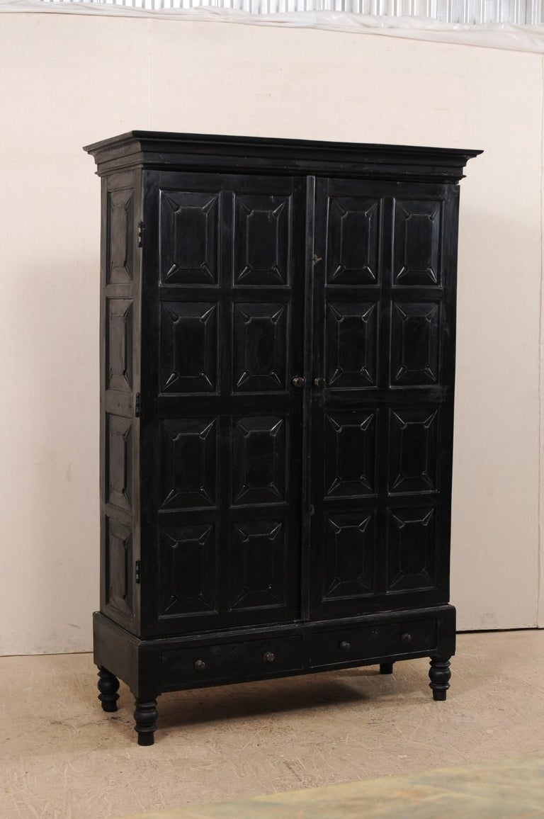 Tall British Colonial Carved Wood Storage Cabinet From The Mid