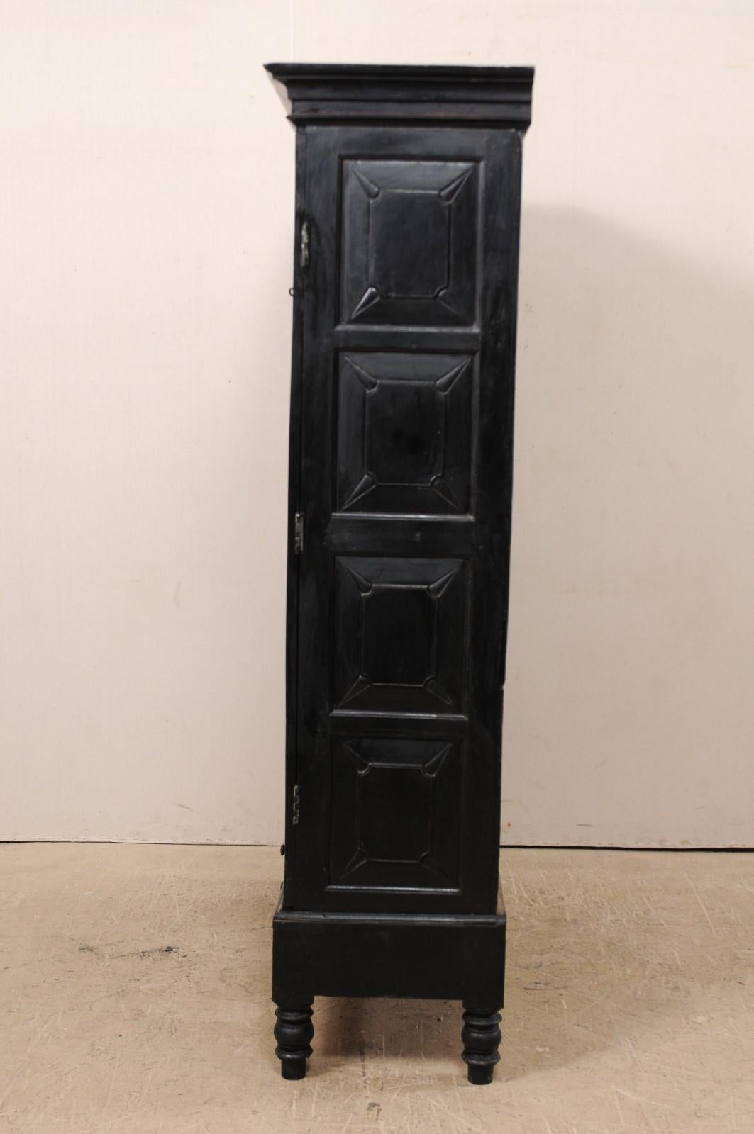 Tall British Colonial Carved Wood Storage Cabinet from the Mid-20th Century In Good Condition In Atlanta, GA