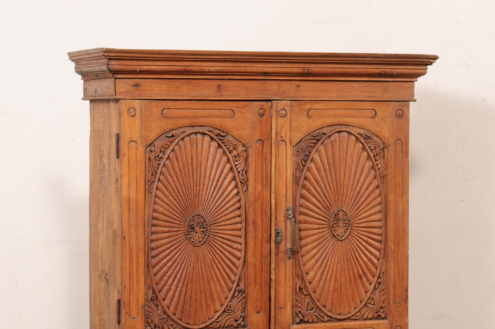 tall carved cabinet