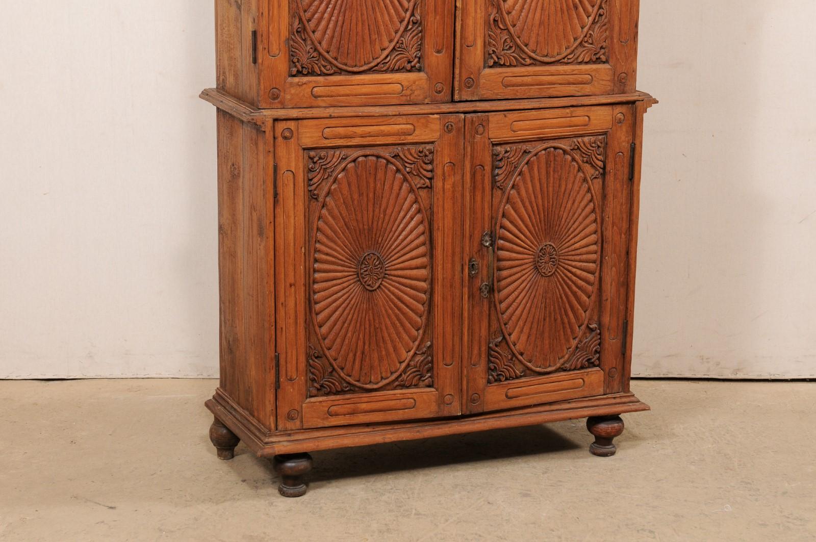 tall carved wood cabinet