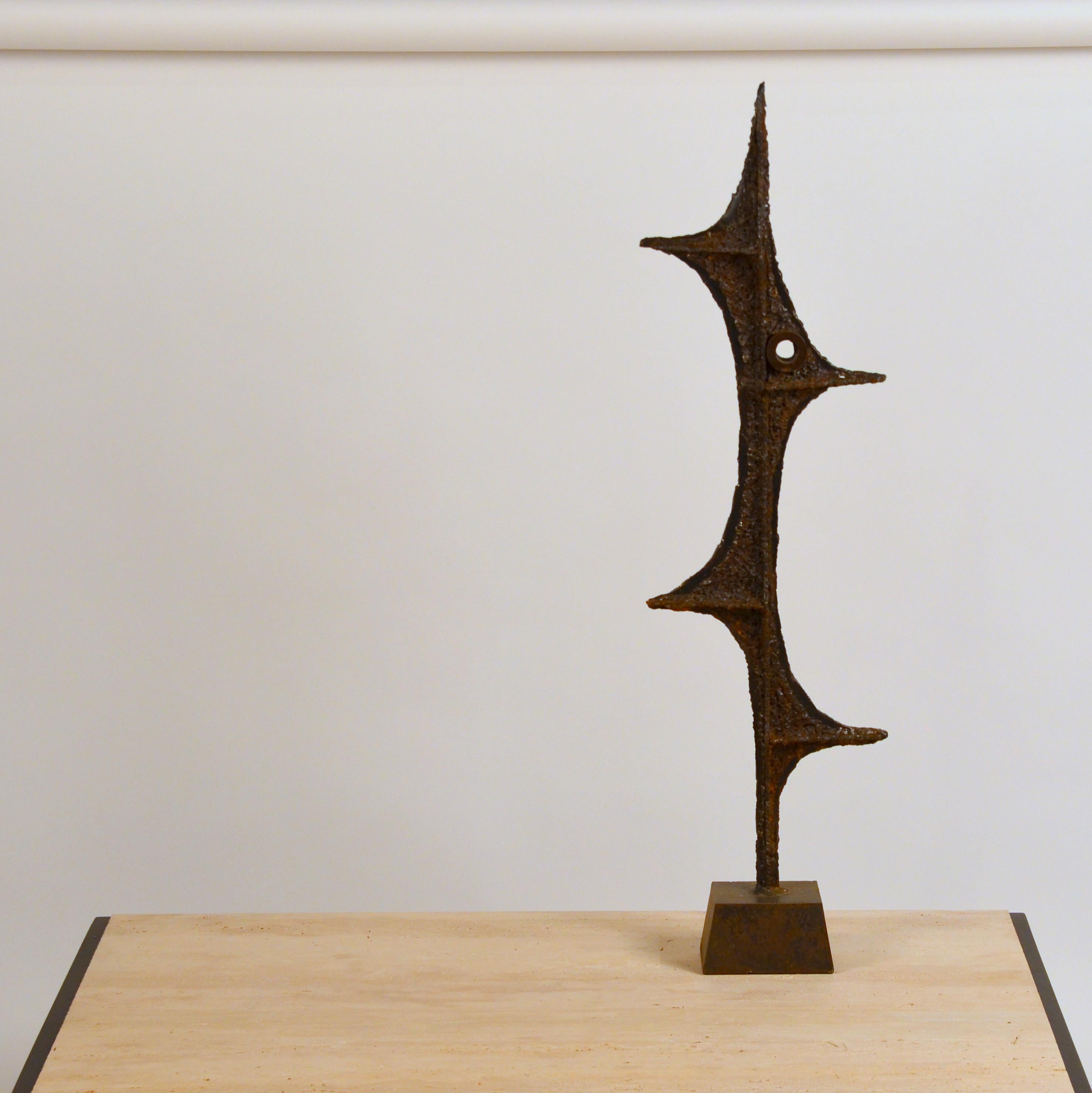 Tall Brutalist studio sculpture by John De La Rosa. Signed.

The last image shows a similar sculpture in an interior setting, for inspiration.