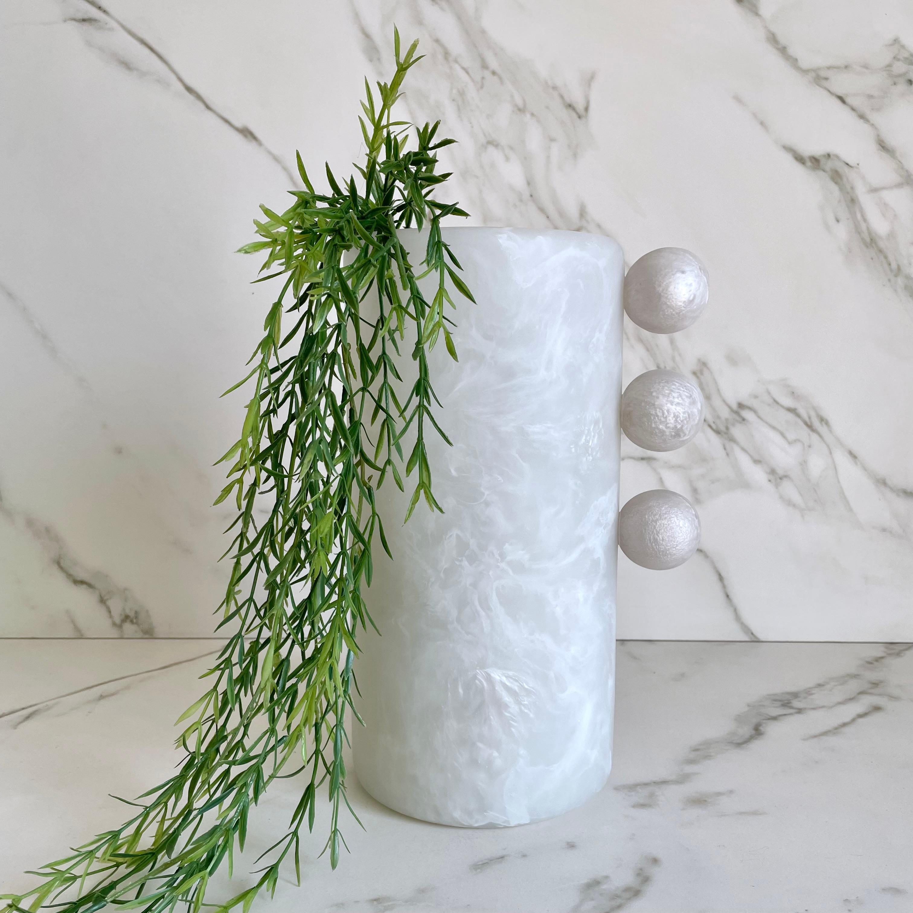 Striking and elegant, the Tall Bubble Vase has a unique silhouette that brings a modern and playful feel to any space. Styled in built-ins or filled with florals, this vase is as versatile as it is beautiful.

Available in two sizes: Tall and