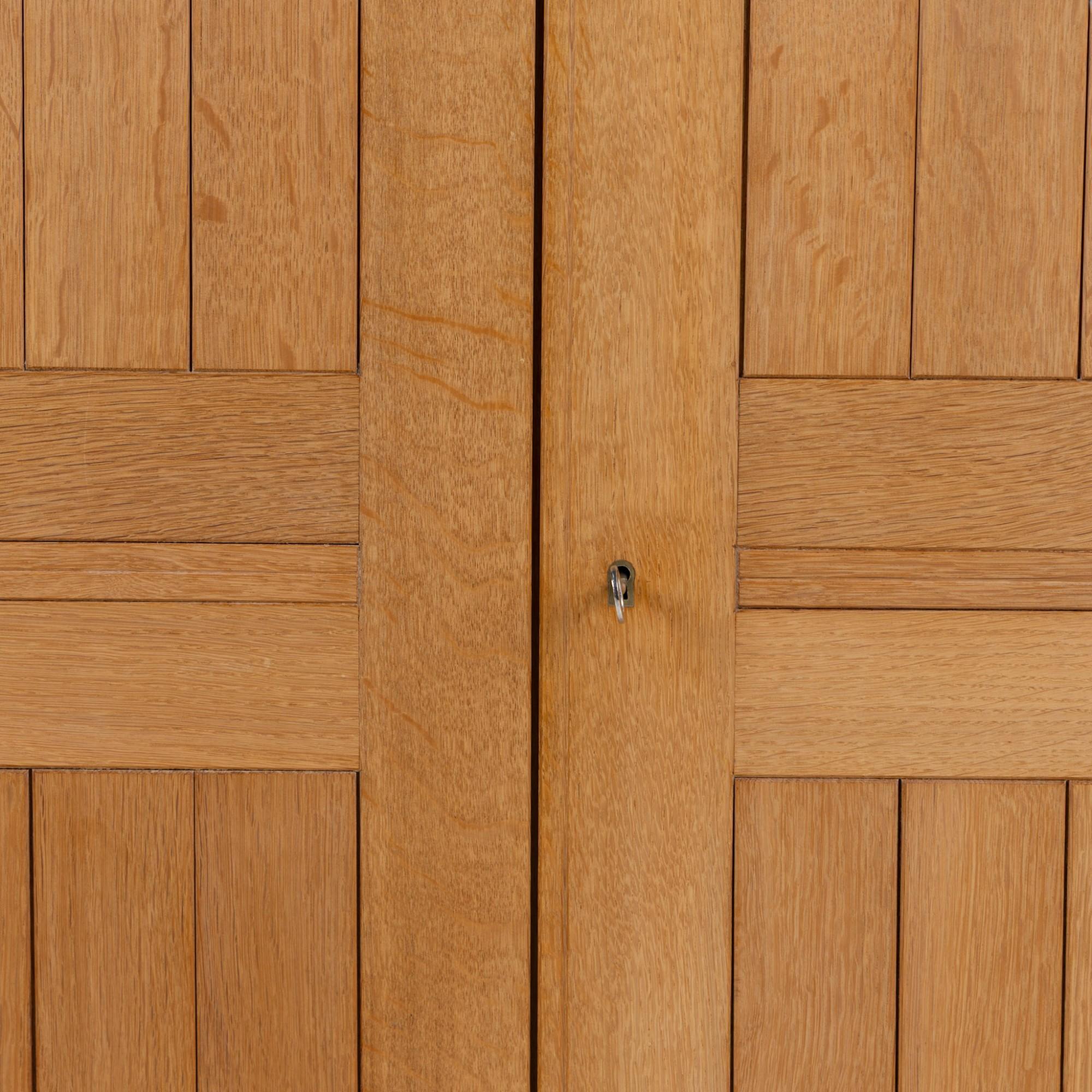 Danish Tall cabinet in oak by Mogens Koch For Sale