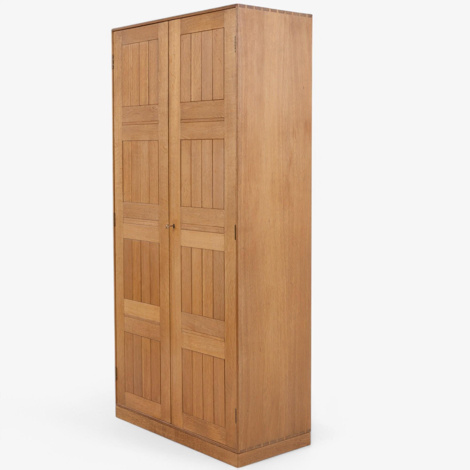 Brass Tall cabinet in oak by Mogens Koch For Sale