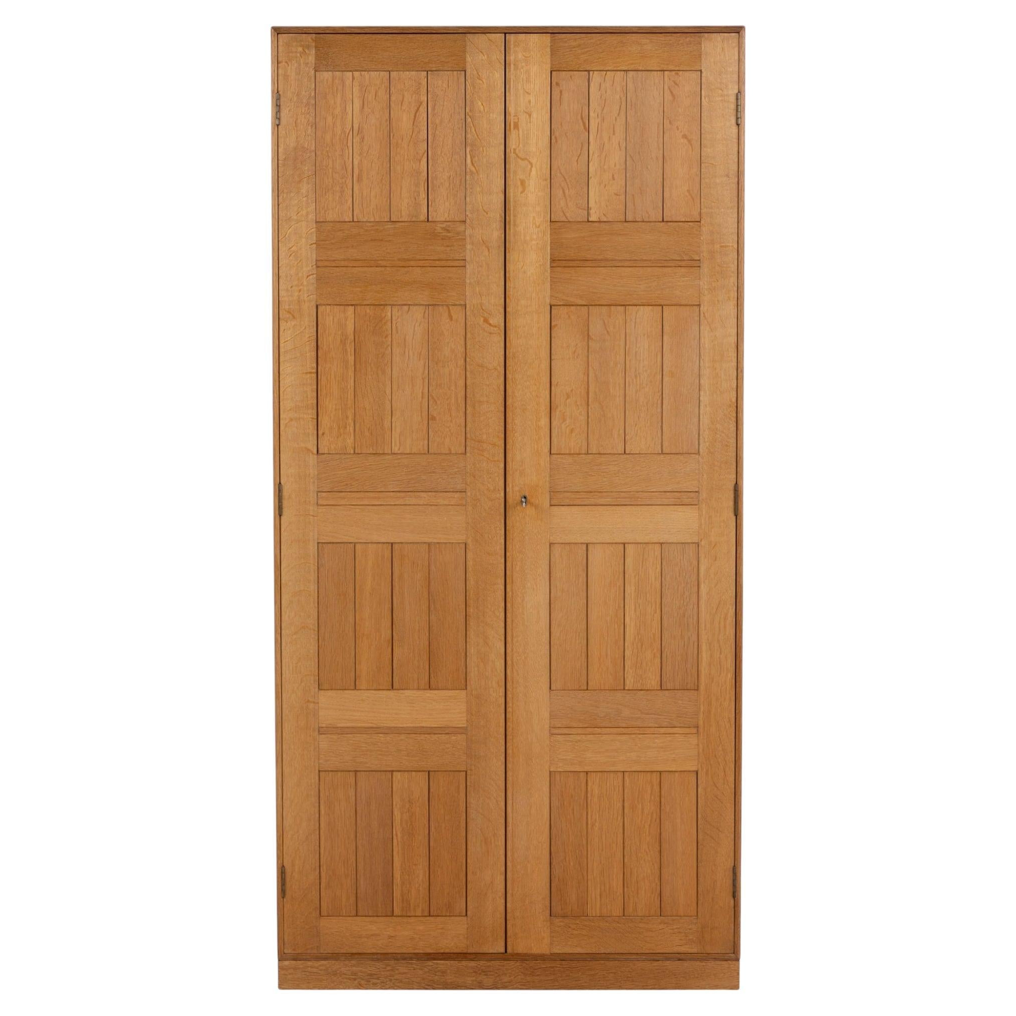 Tall cabinet in oak by Mogens Koch For Sale