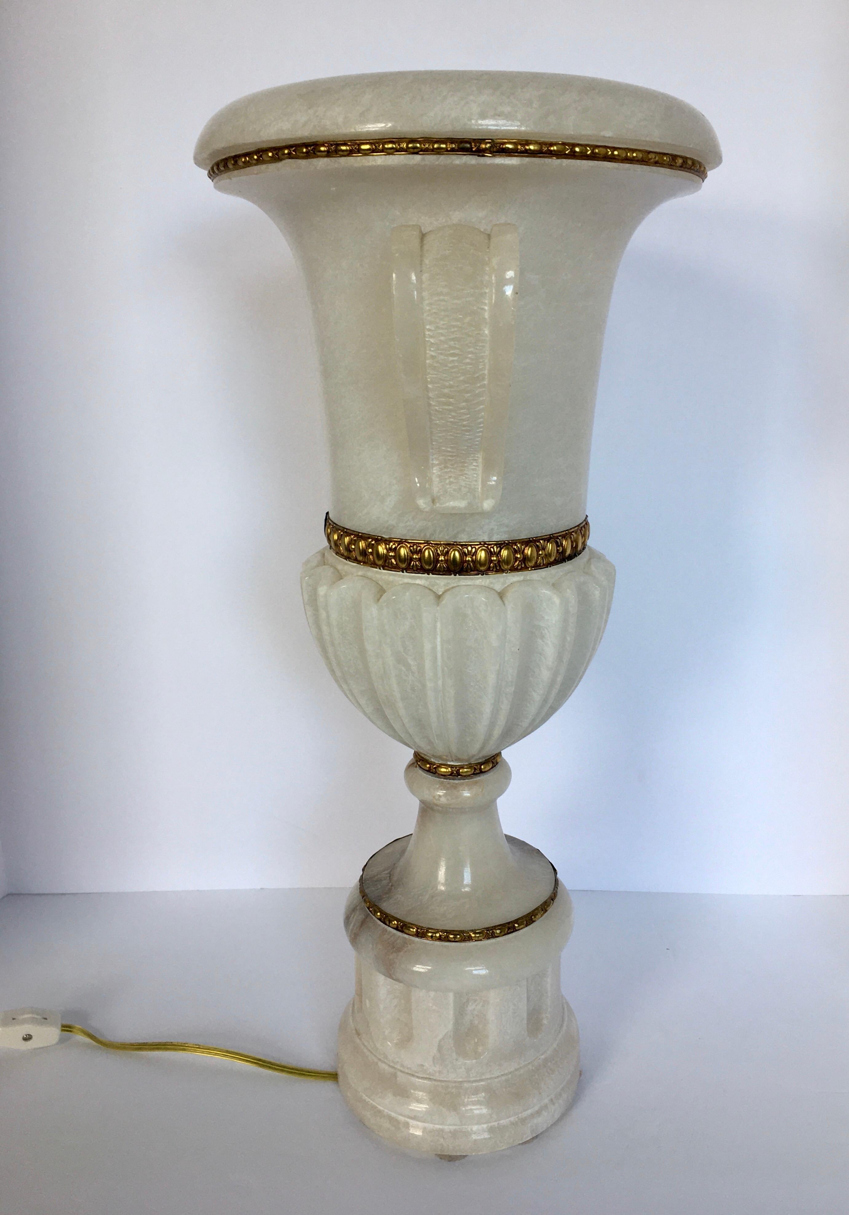 Beautifully carved Italian alabaster marble handled urn table lamp, early 20th century. Classic urn form features decorative bronze fittings, sculptural curved side handles, and a fluted column plinth base.

  