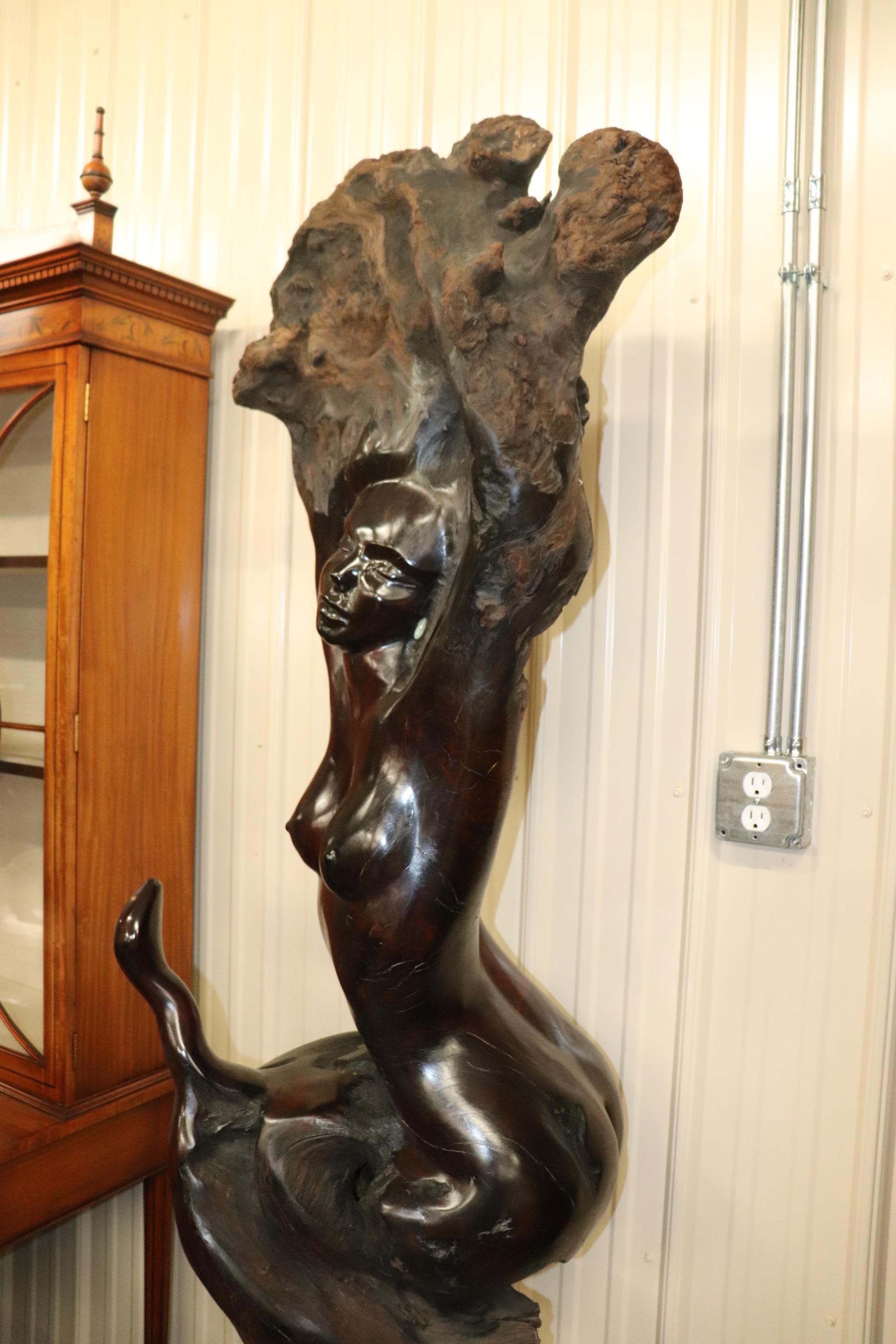 This is a very large and heavy beautifully carved nude figure of a women and a snake facing her appearing to be charmed or gazing at her. The carving is very tall at approximately 83 tall x 21 wide x 20 deep and is just beautifully done. The