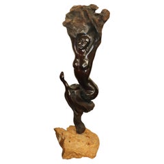 Tall Carved Rosewood Figural Sculpture of a Nude Women and a Snake