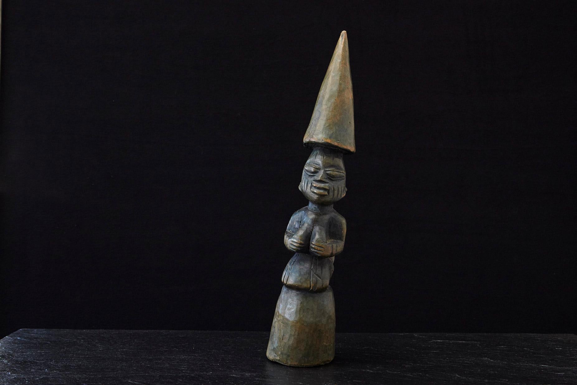 Tall hand-carved wooden oracle or divination tapper 