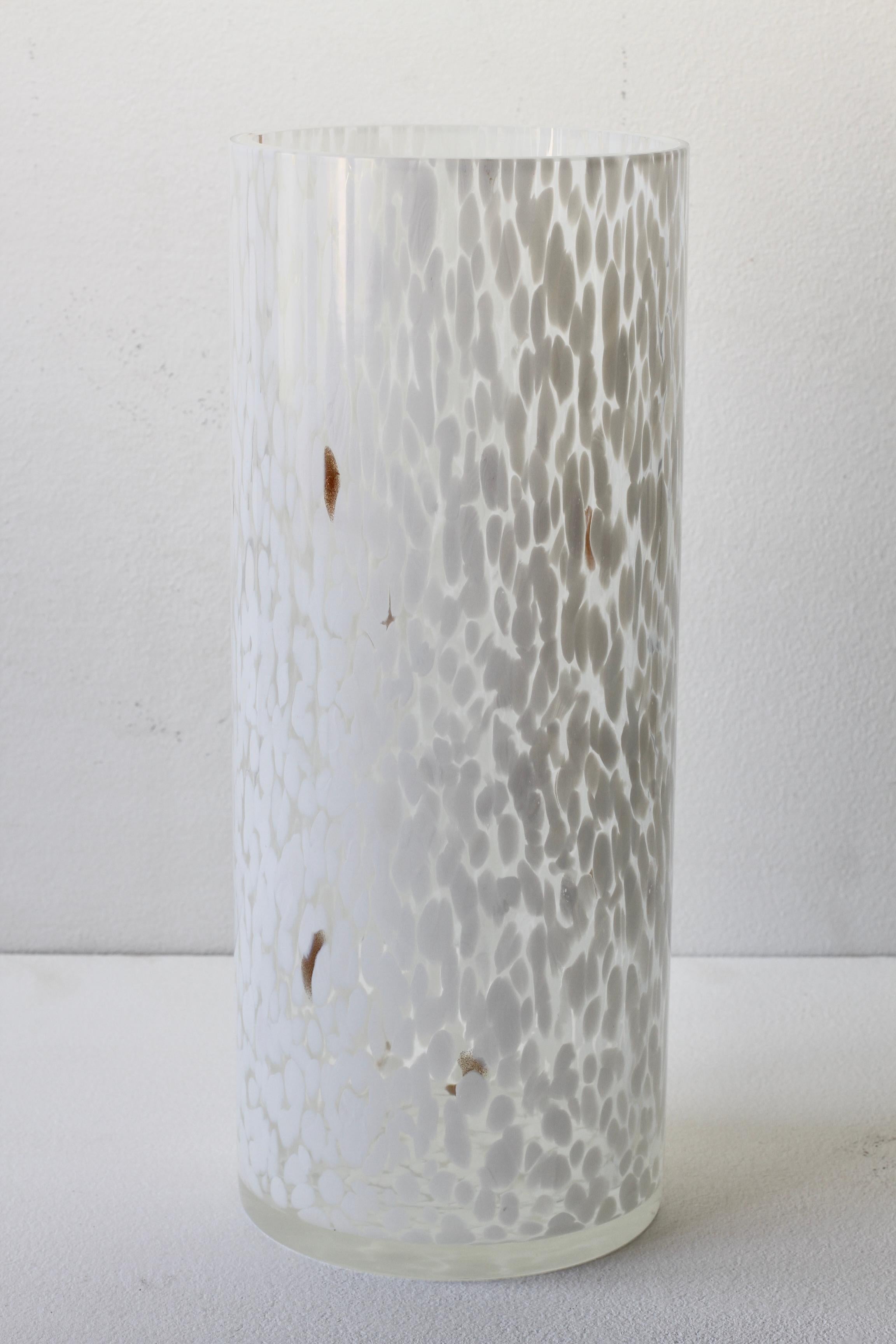 Large, tall and rare 'Lattimo Aventurine' Cenedese vintage Italian midcentury modern Murano glass vase, made on the island of Murano, Italy, circa 1970-1990. Particularly striking is the white speckled, dotted patches encased in clear glass with