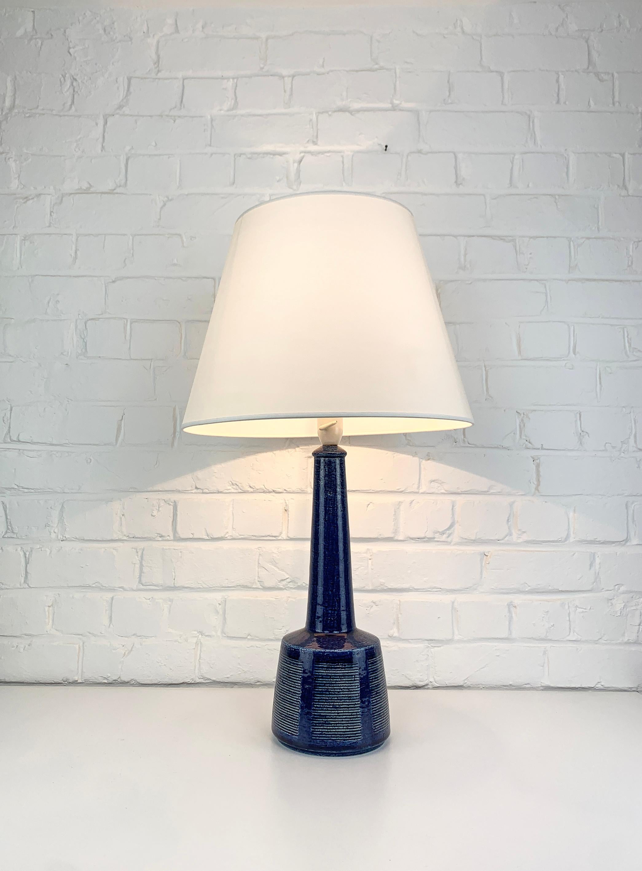 The lamp has been designed by Esben Klint, the son of Kaare Klint (the famous danish furniture designer). Esben has created a timeless design with this model, it has a contemporary and graphic side despite being over 50 years old.

These lamps have
