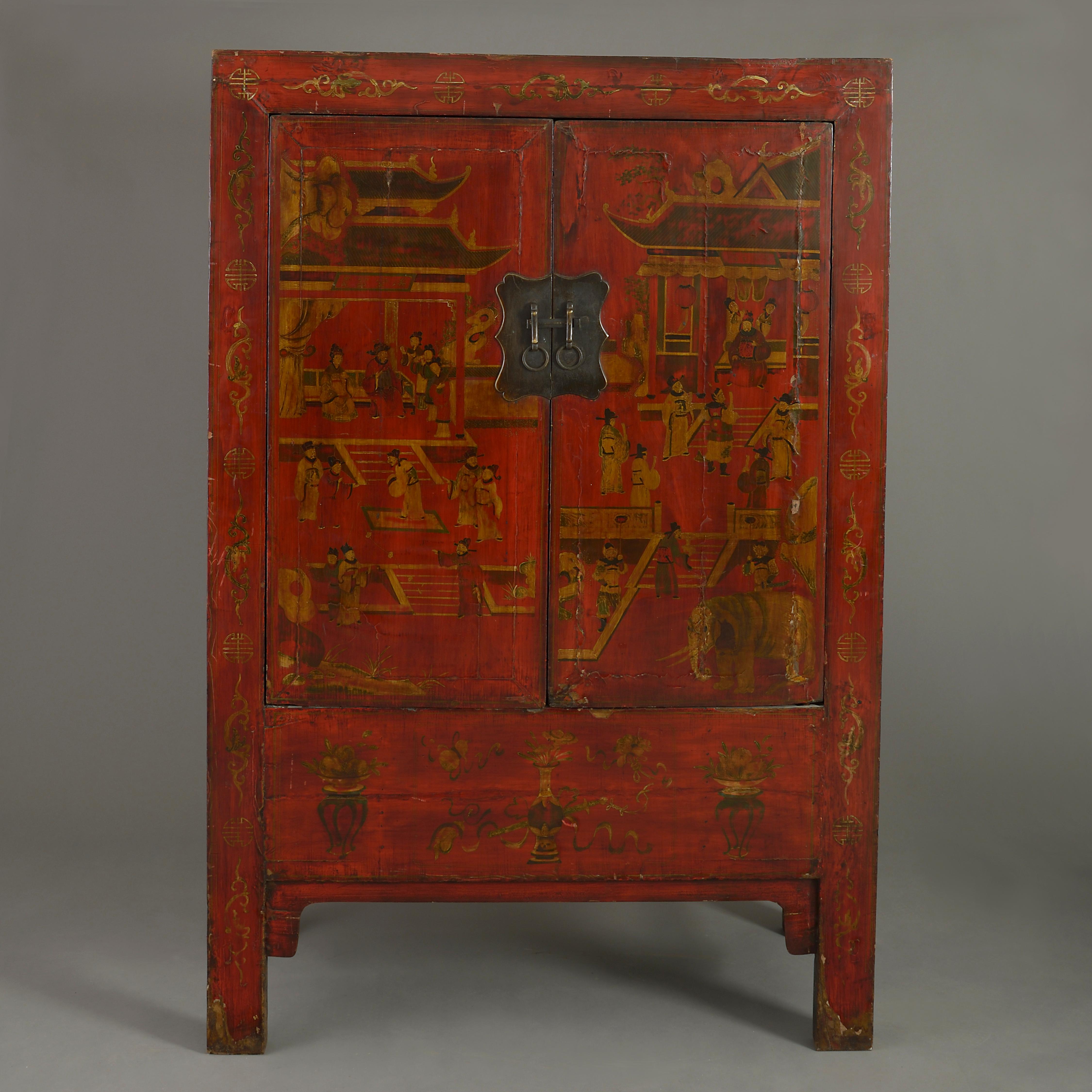 A tall early 20th century red lacquer cabinet, having two doors opening to reveal shelves, raised upon stile feet, with figurative decoration throughout.

    
