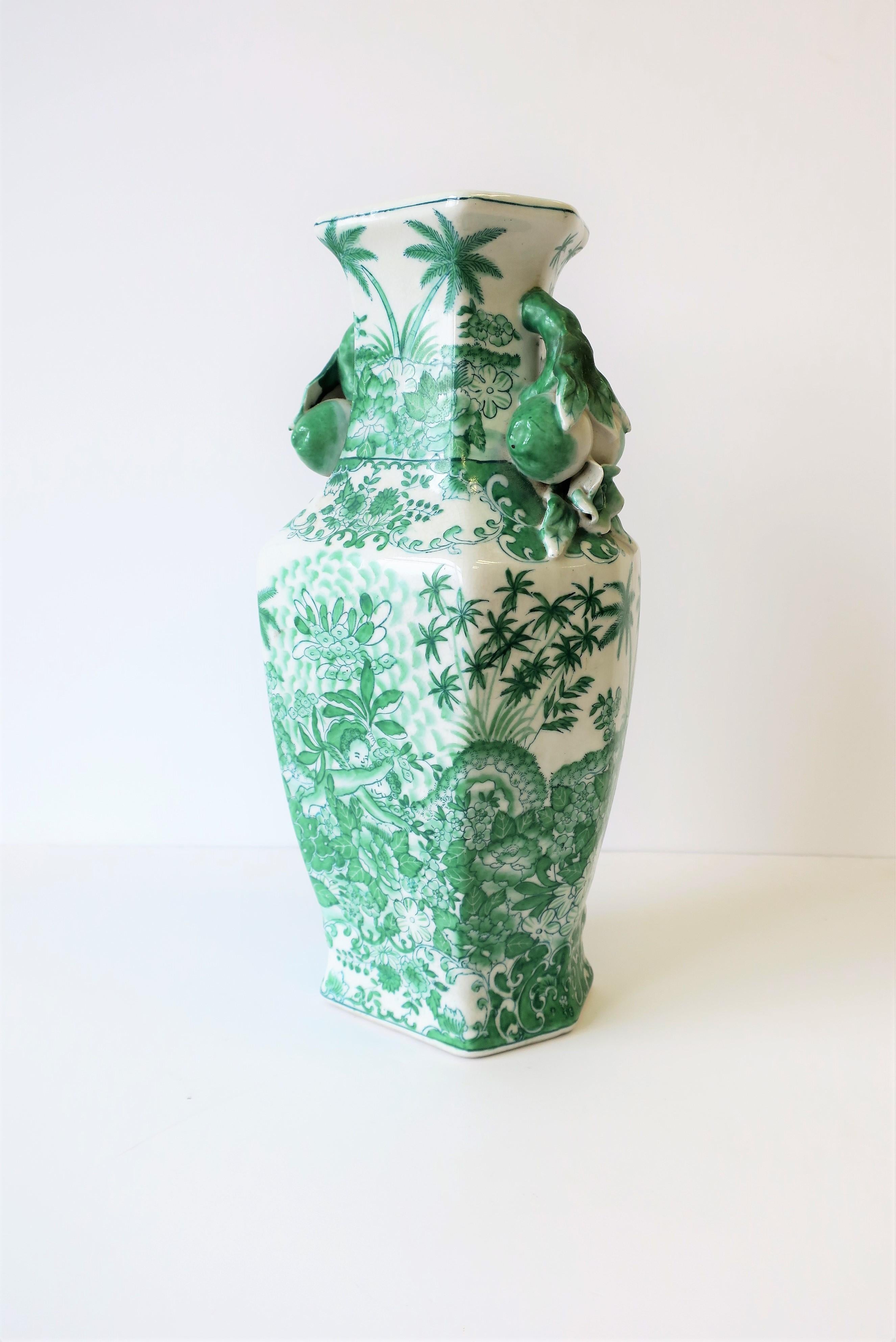 green and white chinoiserie vases