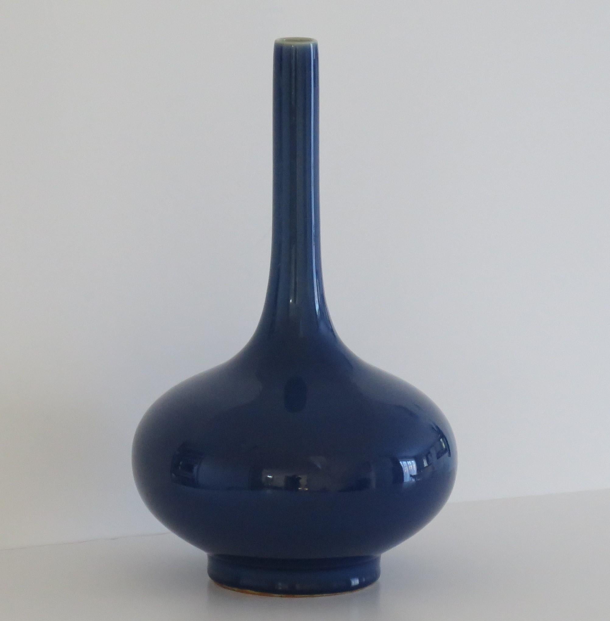 This is a very beautiful, highly decorative Tall Chinese bottle vase with a monochrome or single glaze colour of a fine sapphire-blue,  which we date to the late 19th century,  Qing period .

This Chinese Export vase is well potted on a fairly tall