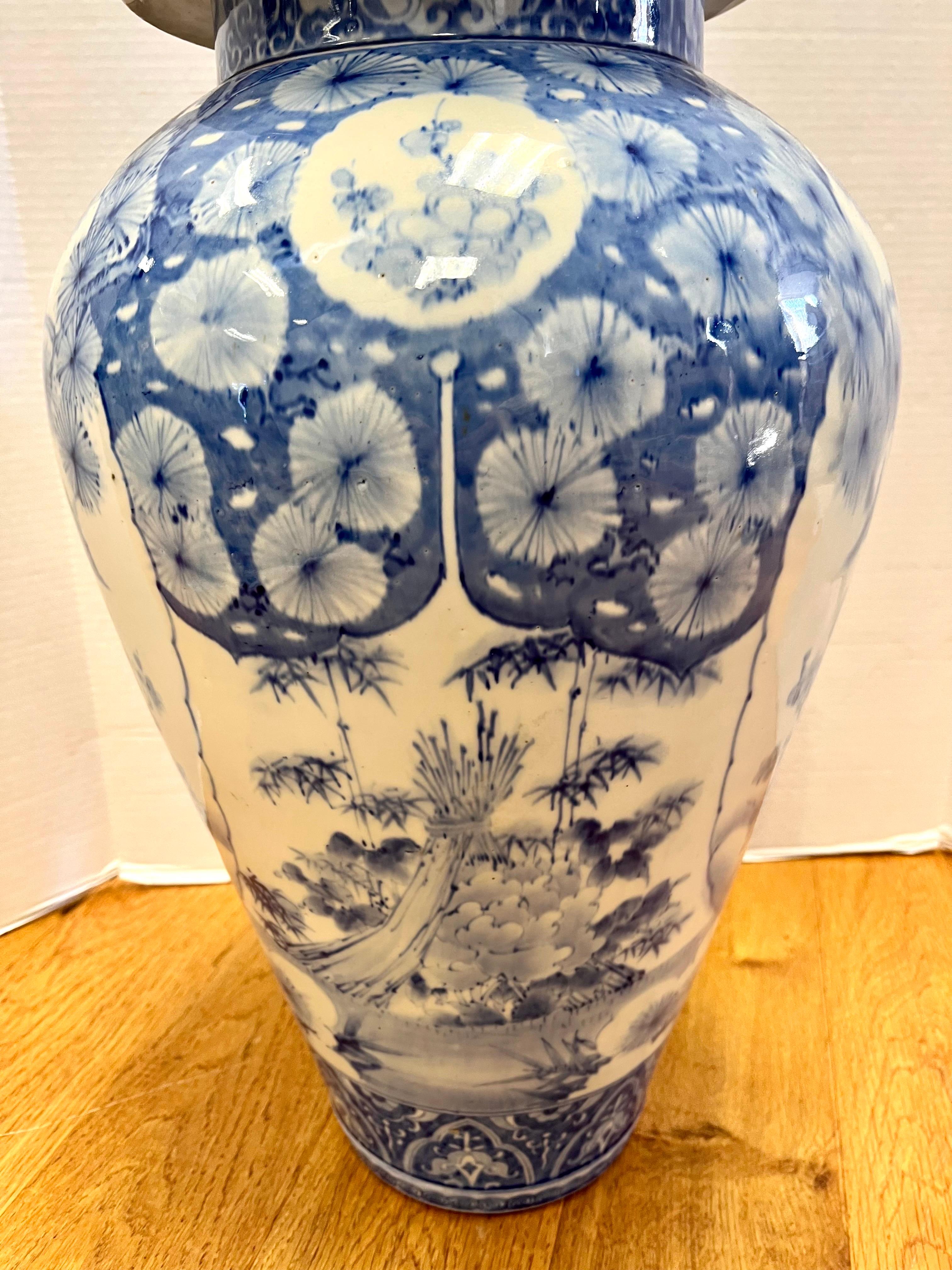 Chinese Tall Chinoiserie Blue and White Ginger Jar Urn with Foo Dog For Sale