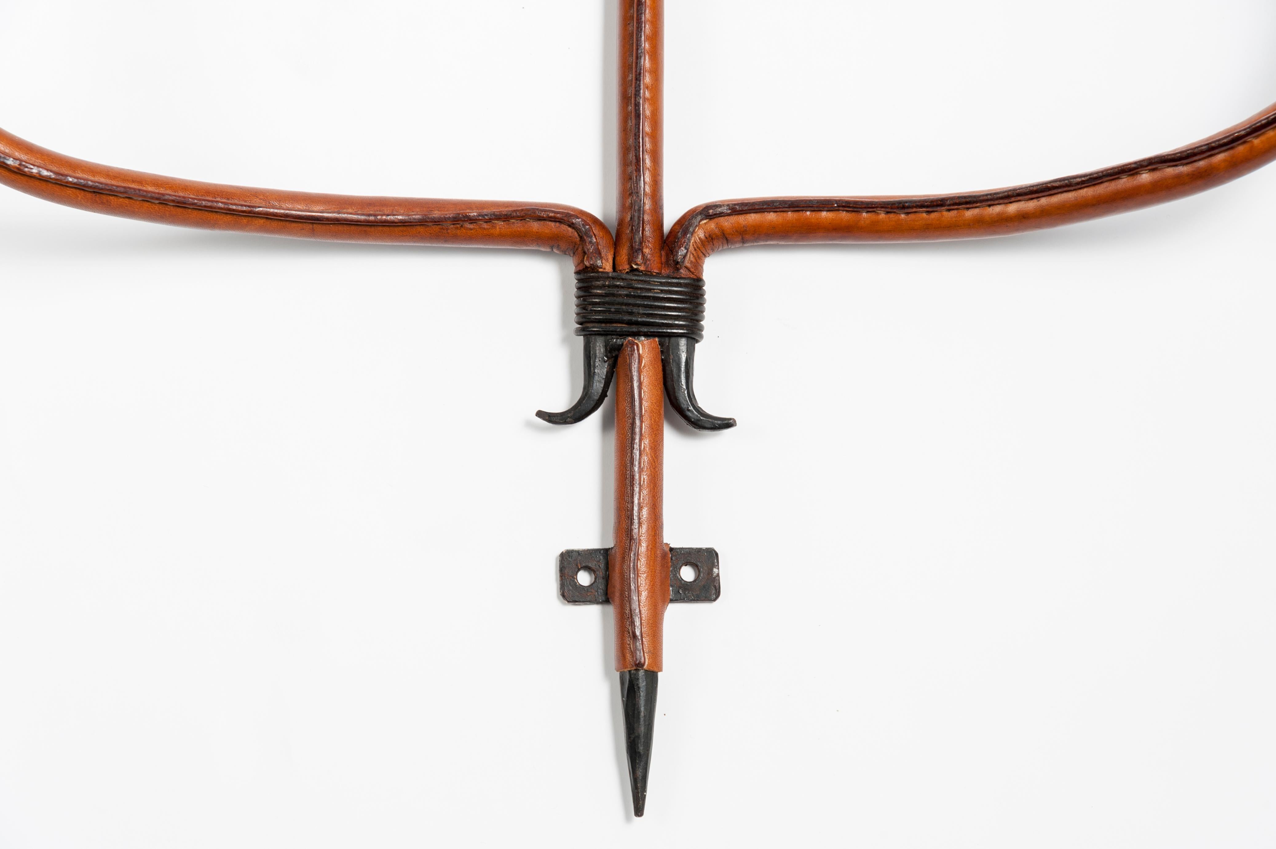 Very nice stitched leather coat rack by Jacques Adnet
Very unusual in this size.
 
