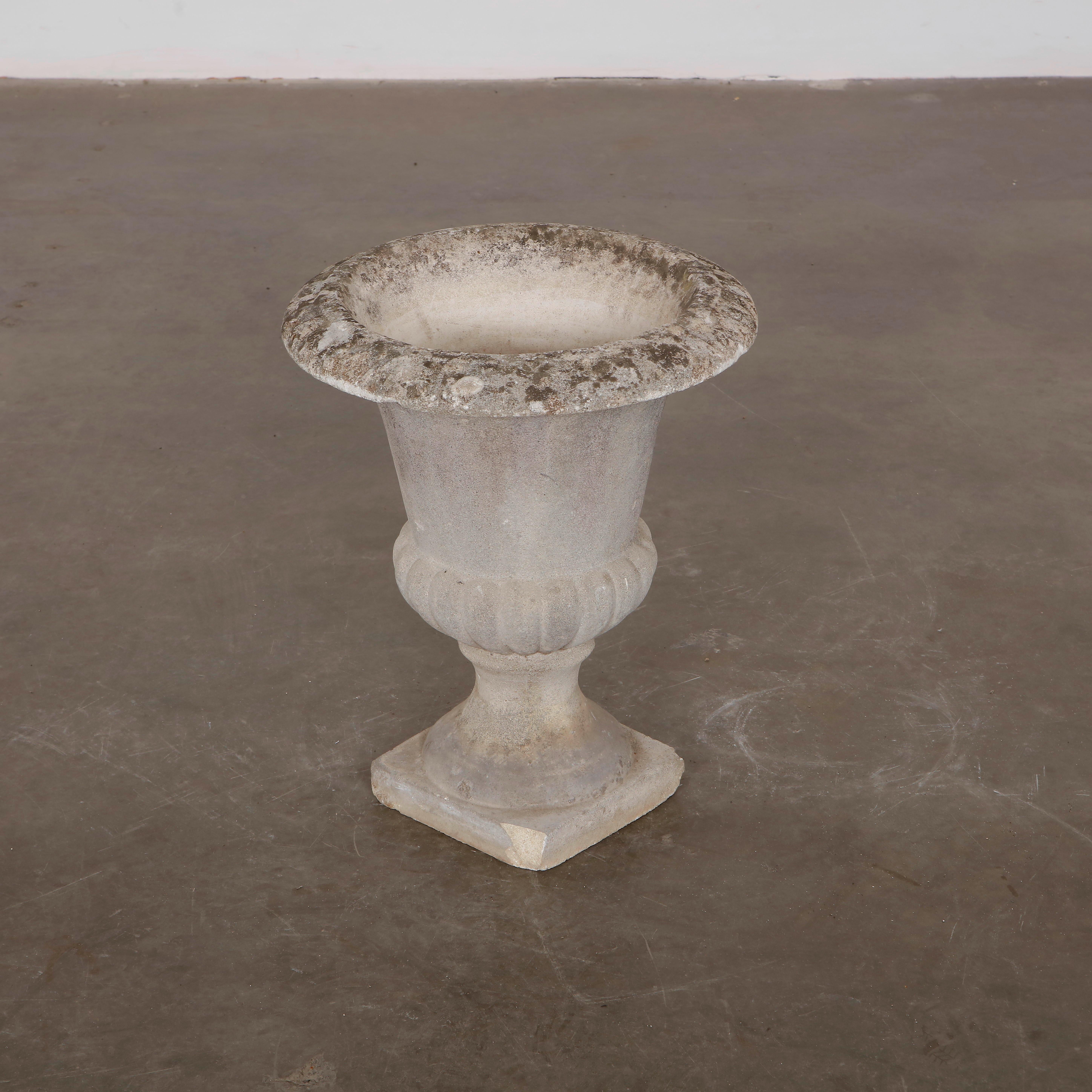 Rare 1960s concrete large urn planter, featuring a timeless silhouette and weathered patina. Overall Diameter: 17 in. Height: 21 in.