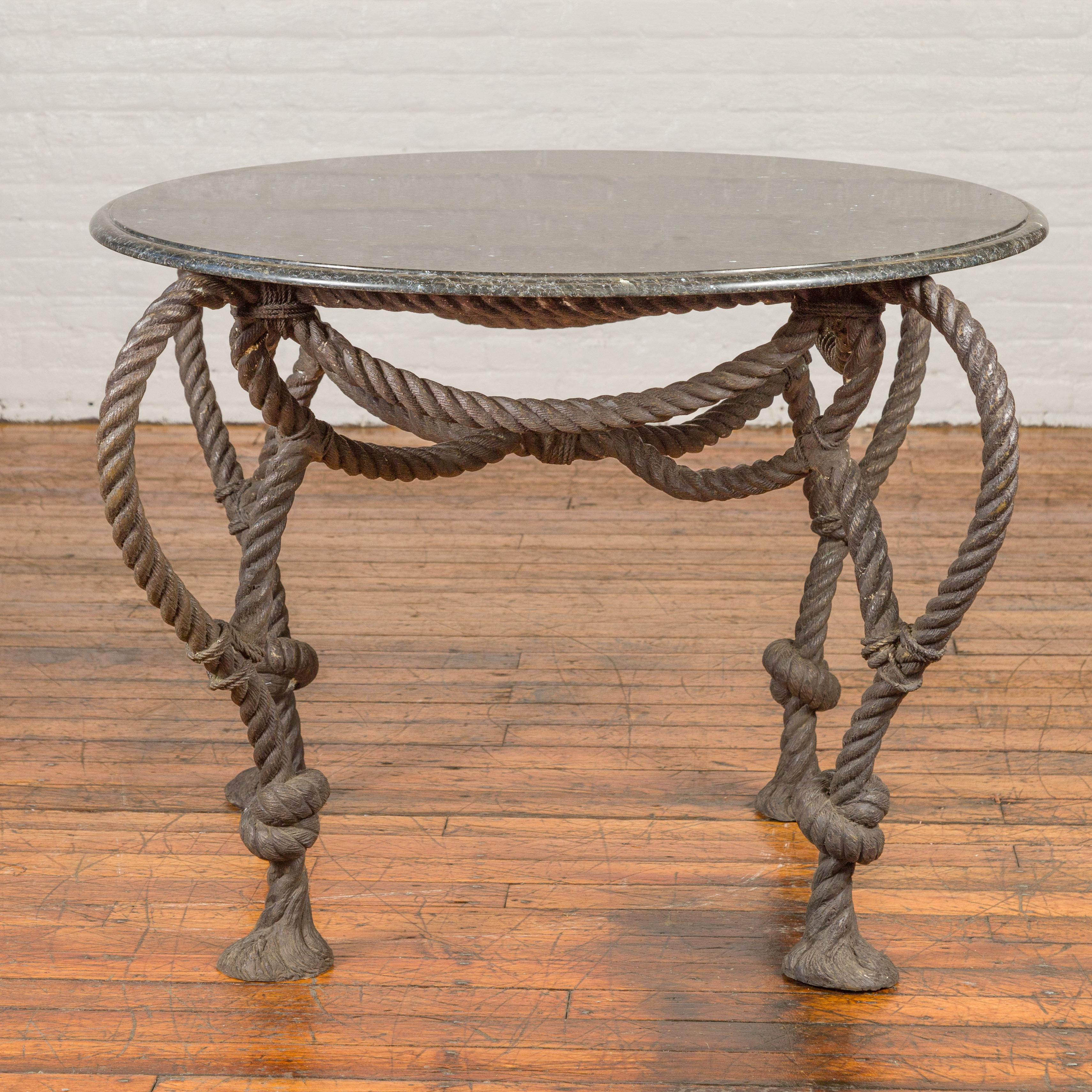 A contemporary bronze dining table or center table base in the manner of Maison Jansen, with nautical rope theme, tassels and dark patina. The tops are not included but shown on the photos to allow a better visualization of the possibilities.