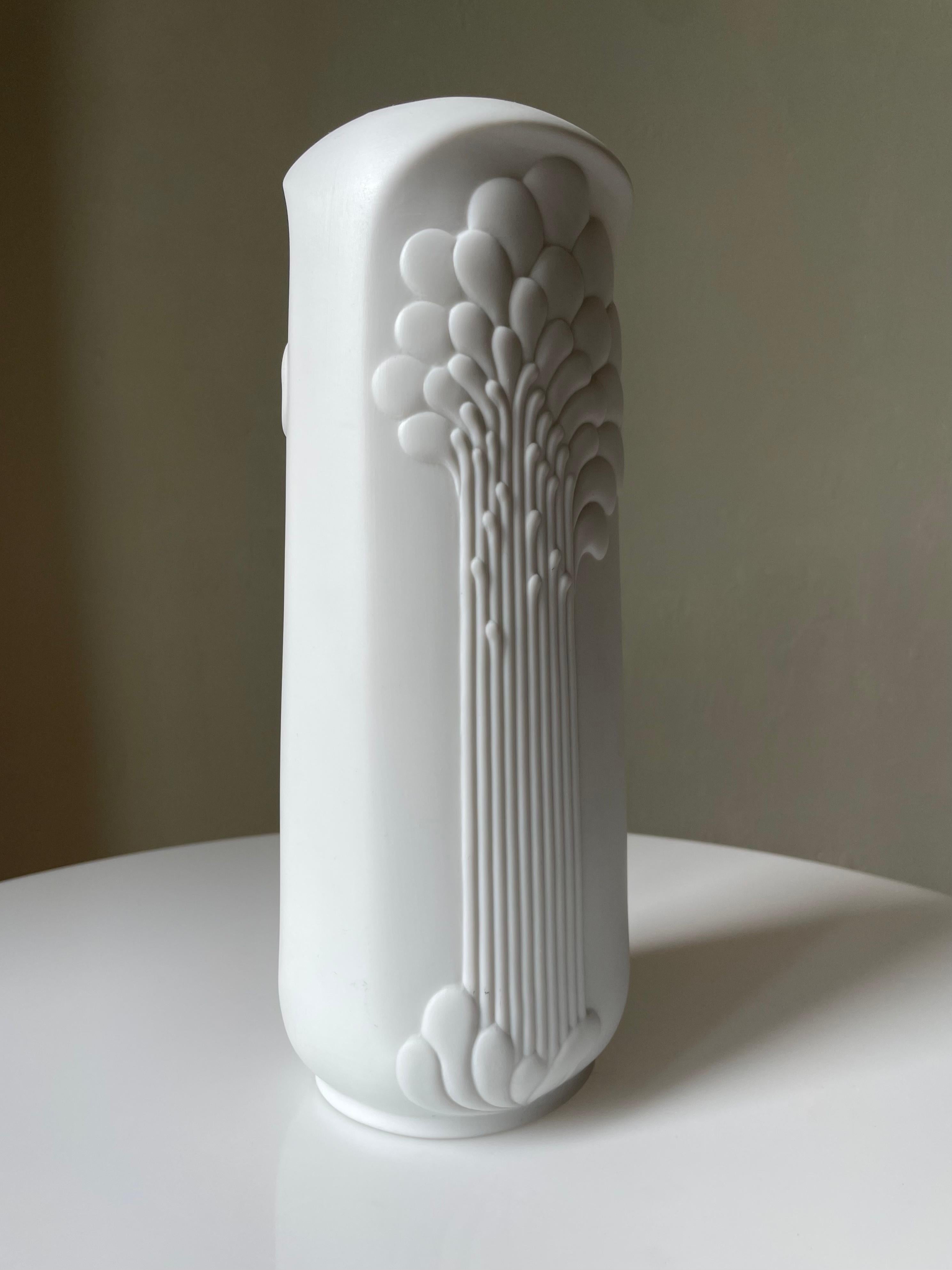 Tall Modern Op Art vase of high quality matte bisque porcelain. Stunning organic art deco relief decor on the bone white exterior, and shiny glaze on the smooth inside. Designed by Michaela Frey for Alboth & Kaiser Porcelain in the 1960s. Signed,